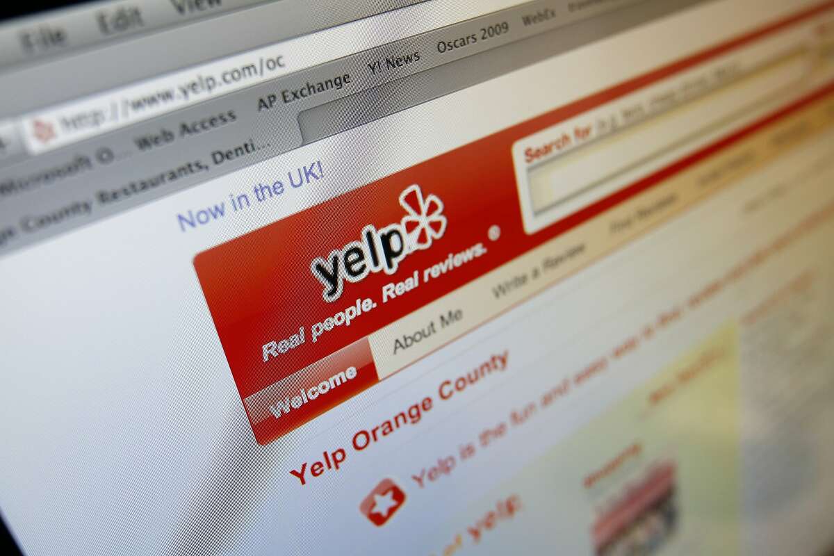 The Yelp Web site is shown on a computer screen in Los Angeles. Yelp now letting visitors see those that are automatically filtered out by software meant to catch content that isn't trustworthy.