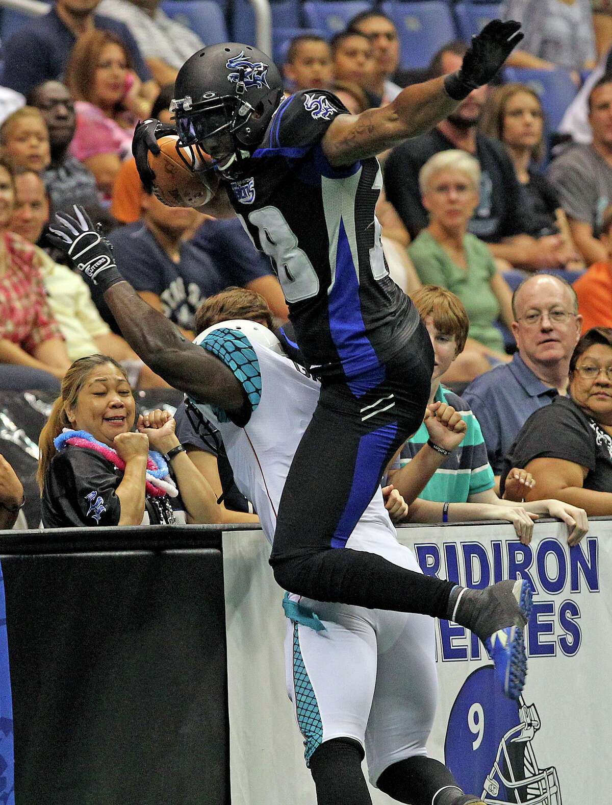 Talons wide receiver Derek Lee gets over the back of a defender to stay in bounds on a catch as the Talons host the Arizona Rattlers at the Alamodome on July 13, 2012.