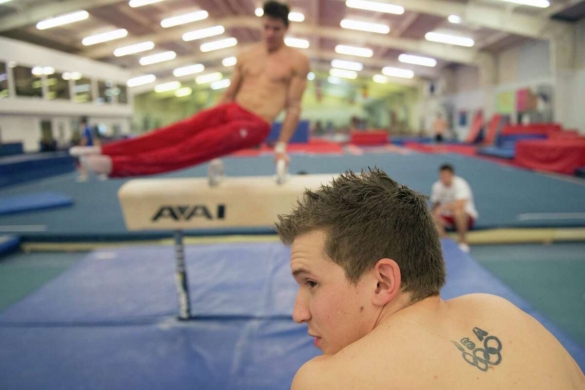 Gymnasts Jonathan Horton, foreground, and Chris Brooks, who train at Cypress Academy of Gymnastics, are the latest area athletes headed to the Olympics.
