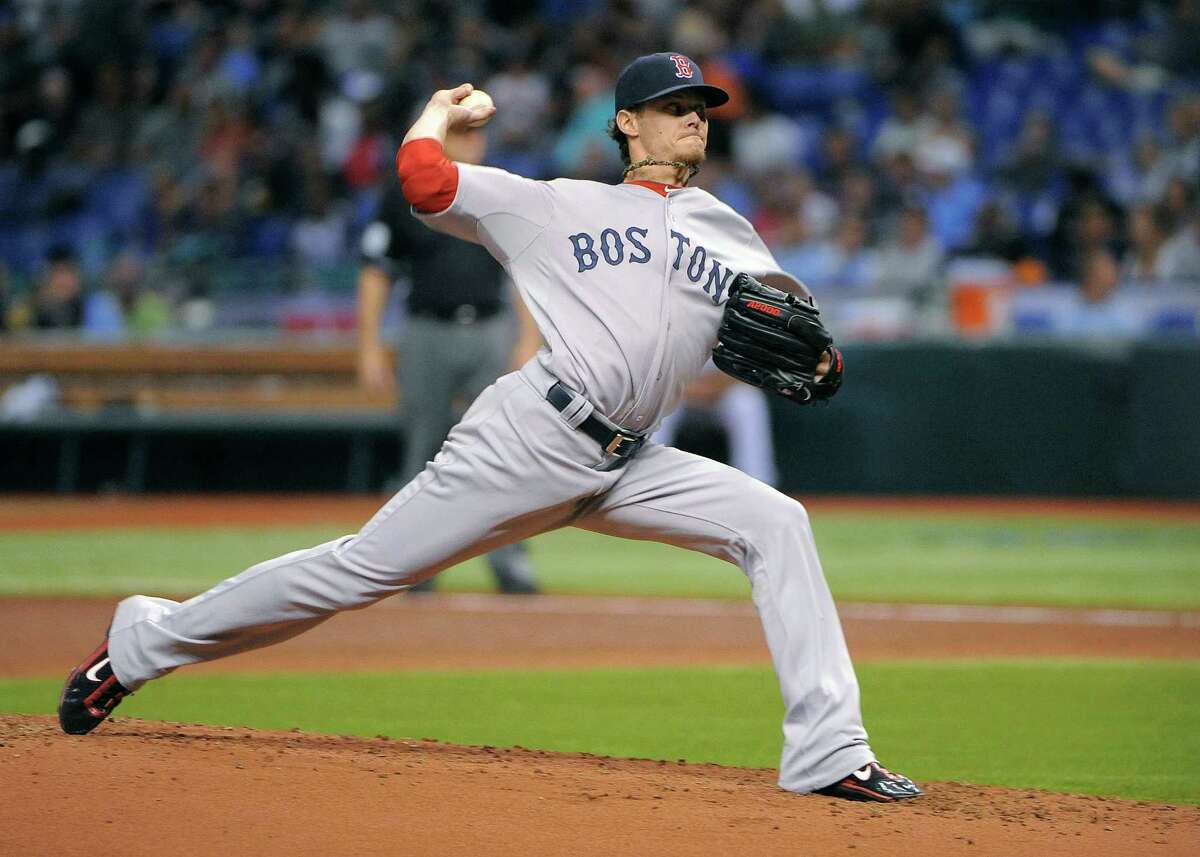 Boston Red Sox starting pitcher Clay Buchholz delivers to the Tampa Bay Rays during the first inning of a baseball game Saturday, July 14, 2012, in St. Petersburg, Fla. The Rays won 5-3. (AP Photo/Brian Blanco)