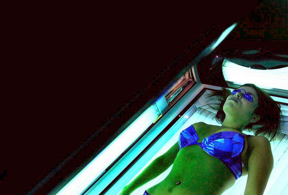 A woman uses the tanning bed. (Times Union archive) Photo: STEVE JACOBSS