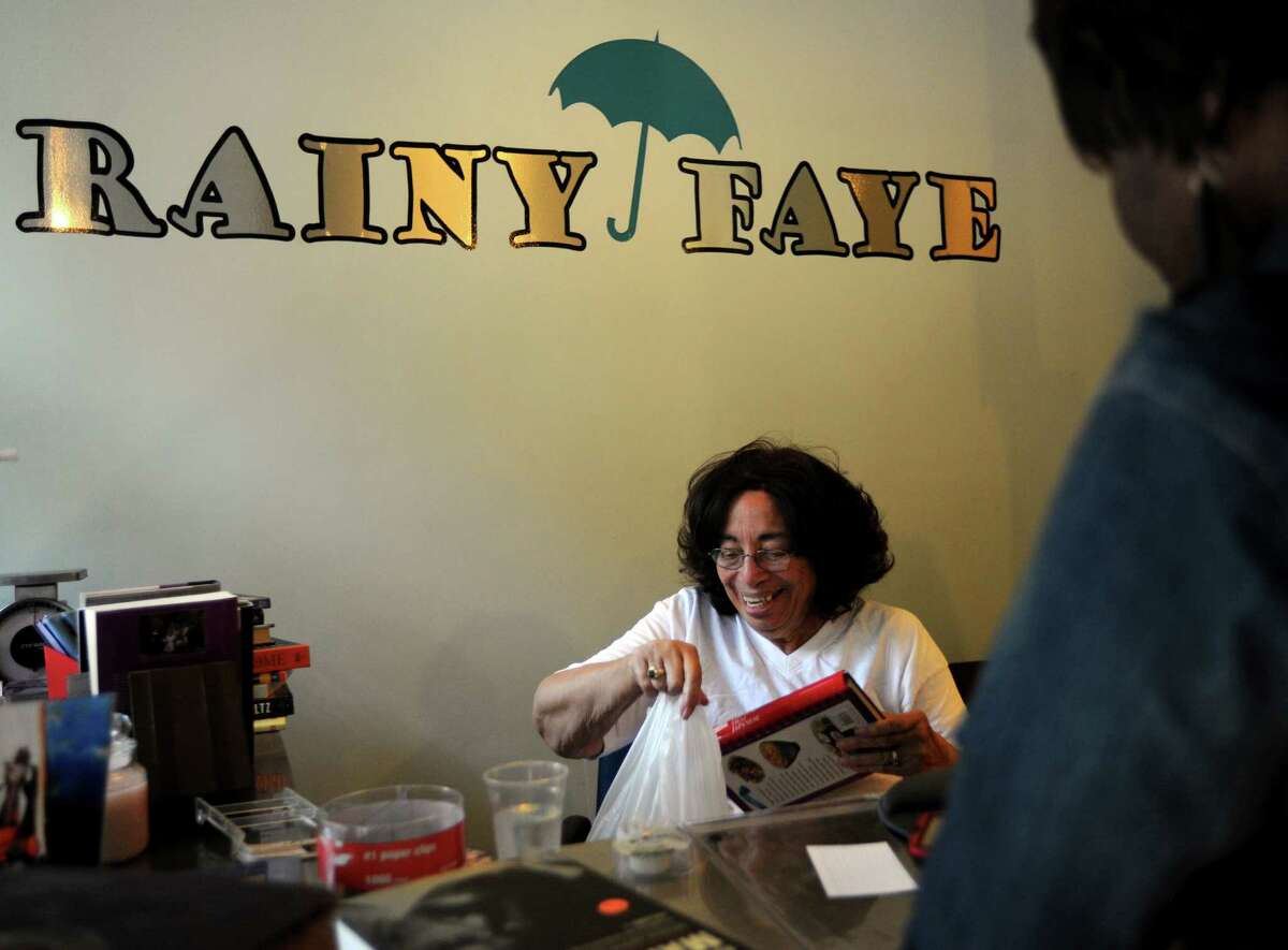 Rainy Faye Bookstore owner Dr. Georgia Day at her shop at 1042 Broad Street in Bridgeport, Conn. on Tuesday July 17, 2012. Day is planning to close the store on August 1st.