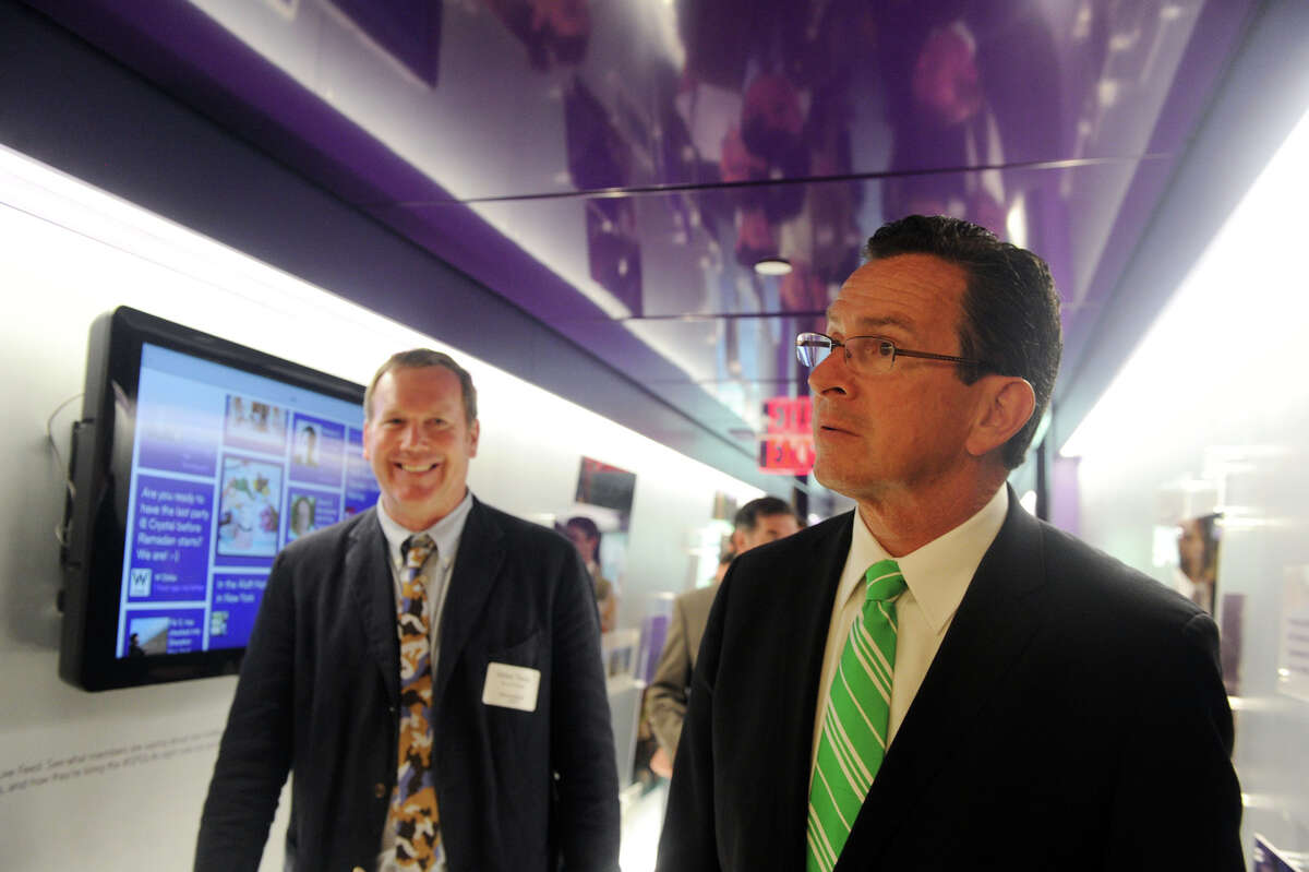 Governor Dannel P. Malloy and Senior Vice President of Global Brand and Innovation at Starwood Hotels & Resorts Mike Tiedy take a tour as Starwood Hotels & Resorts hosts the opening of its new "Starwood Experience" at 1 StarPoint in Stamford, Conn., July 17, 2012. The space showcases Starwood's nine brands and global corporate programs with vignettes allowing for an interactive experience.