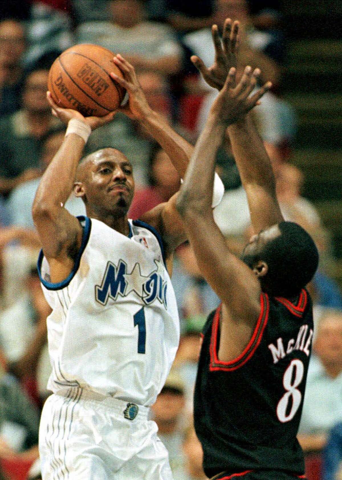 Orlando Magic guard Anfernee Hardaway (1) puts up a shot over Philadelphia 76ers guard Aaron McKie (8) during the Magic's 79-68 win Tuesday night May 11, 1999 in their Eatern Conference. Penny Hardaway met with Los Angeles Lakers executive Jerry West recently, fueling speculation the unrestricted free-agent guard might be reunited with former teammate Shaquille O'Neal. (AP Photo/Steve Simoneau)