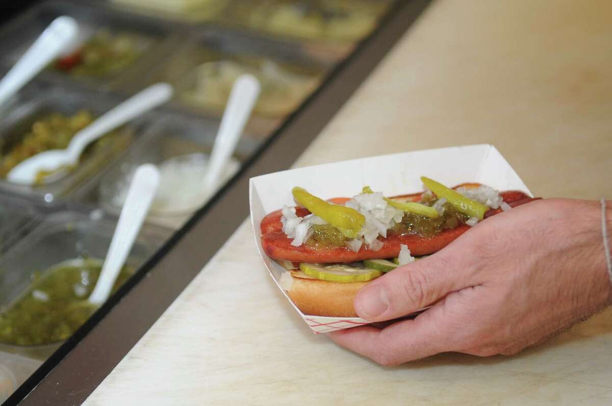 A specialty hot dog is made at Bridge Street Wienery, in Stamford on Wednesday, July 18, 2012.