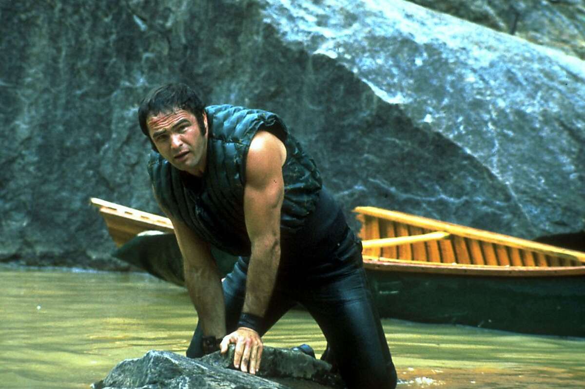This image released by Warner Bros. Entertainment shows actor Burt Reynolds portraying Lewis Medlock in the 1972 film "Deliverance." Four decades ago, the lush northeast Georgia mountains were introduced to the world in the hit film “Deliverance.” Though many in the region still bristle at the movie's portrayal of locals as uneducated, toothless hillbillies who sodomize visitors from the big city, the film helped create the $20 million rafting and outdoor sports industry along the Chattooga River, which splits Georgia and South Carolina and was the fictional Cahulawassee River in the movie. That's why the communities along the Chattooga are celebrating the 40th anniversary of the movie's release with this weekend's first ever Chattooga River Festival. (AP Photo/Warner Bros. Entertainment)