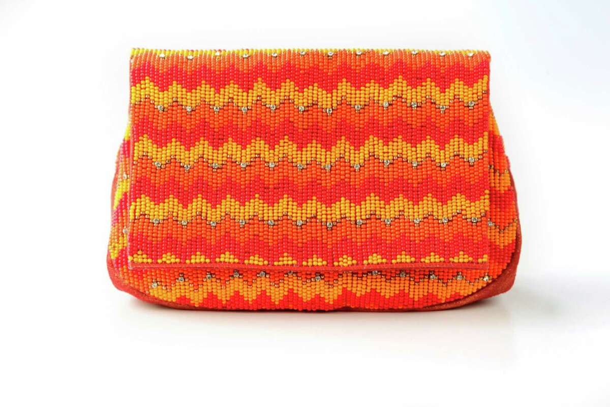 Orange beaded clutch, $198, More Than You Can Imagine Boutique on Westhiemer.