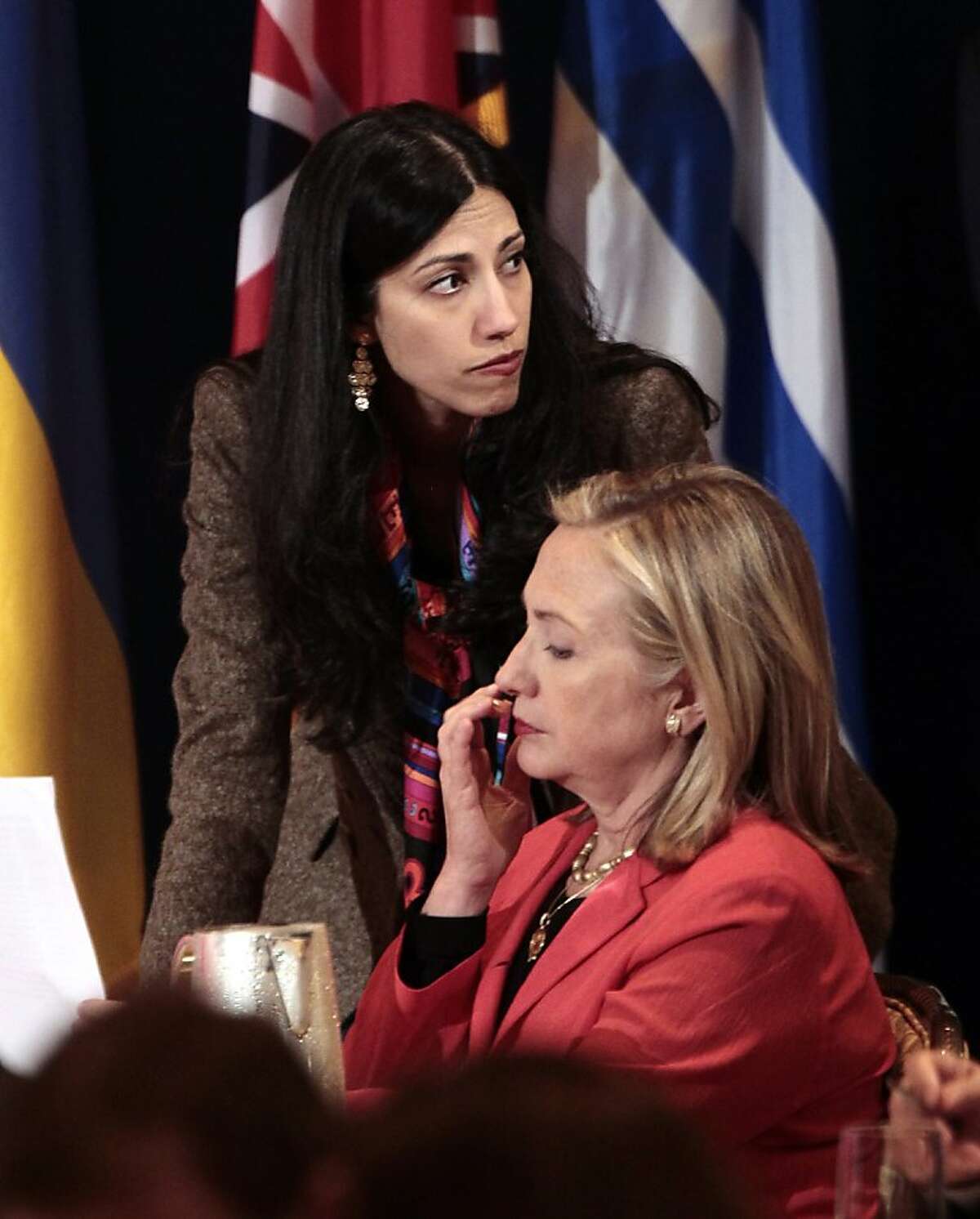 FILE - In this Sept. 20, 2011 file photo, Huma Abedin, top, deputy chief of staff and aide to Secretary of State Hillary Rodham Clinton, right, during a meeting with leaders for the Open Government Partnership in New York. Republican Sen. John McCain is defending a longtime aide to Secretary of State Hillary Rodham Clinton against unsubstantiated allegations that her family has ties to Egypt's Muslim Brotherhood. (AP Photo/Pablo Martinez Monsivais)