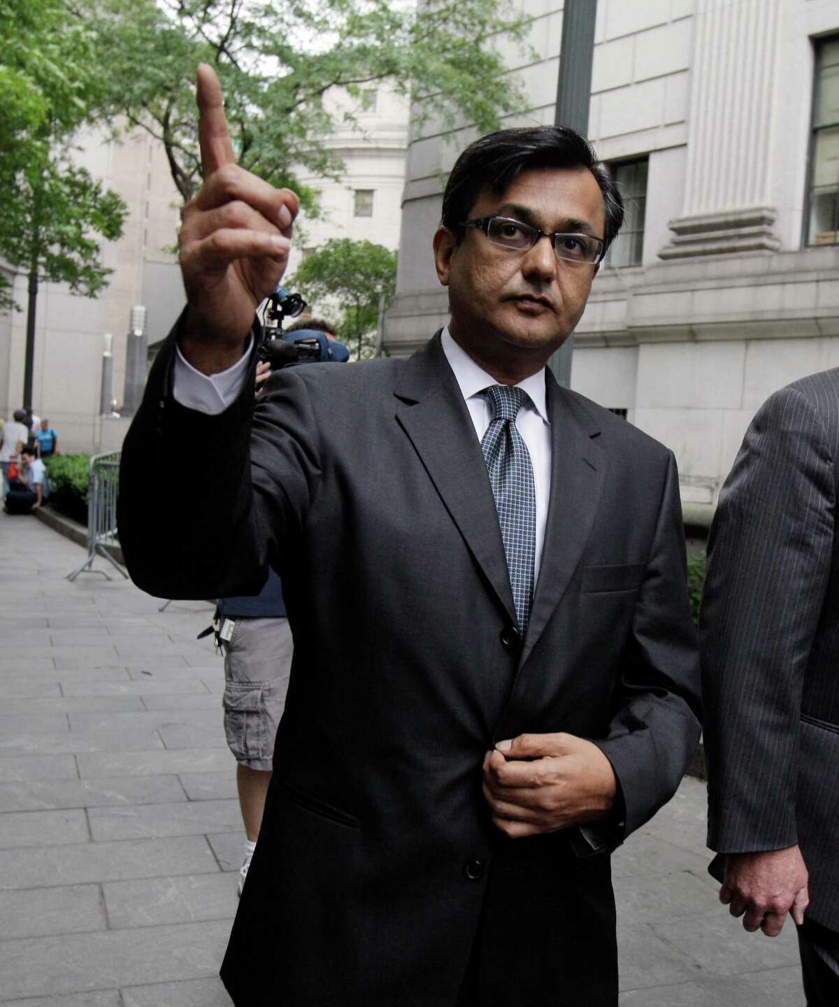 Anil Kumar, a former financial consultant-turned-government witness, leaves Federal Court in New York, Thursday, July 19, 2012. Kumar was sentenced Thursday to two years of probation after prosecutors credited him with helping convict a pair of Wall Street titans on insider trading charges. (AP Photo/Richard Drew)