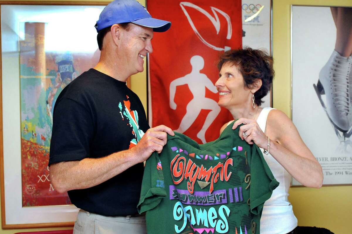 Jim Keller and his wife, Denise, talk about going to the London Olympics and taking their family with them. They are shown here with memoribilia in their New Fairfield home Friday, July 20, 2012.