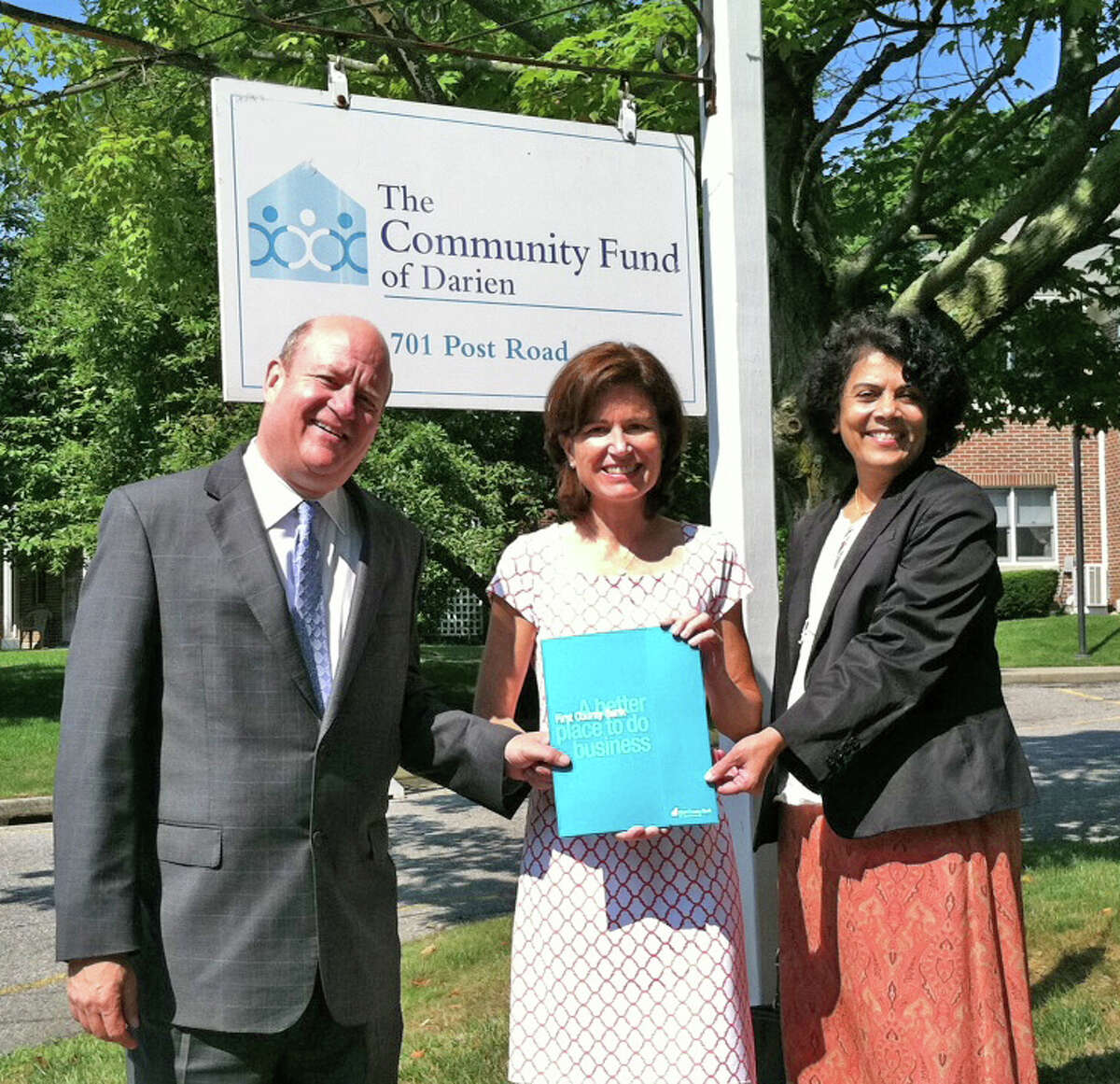 Above, Mark Rosenbloom and Prabhat Jadhav of First County Bank with Jenny Streeter, executive director of The Community Fund of Darien (middle), July 18, 2012.