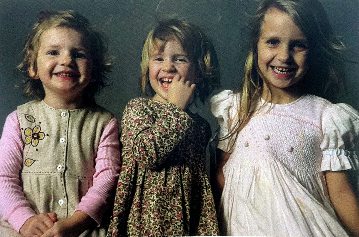 A photo of Grace, Sarah and Lily Badger graces the cover of the program for their funeral at St. Thomas Church Fifth Avenue in New York City on Thursday, Jan. 5, 2012. The three young daughters of Madonna and Matthew Badger died with their grandparents in a Christmas morning fire in Stamford's Shippan neighborhood in Conn.