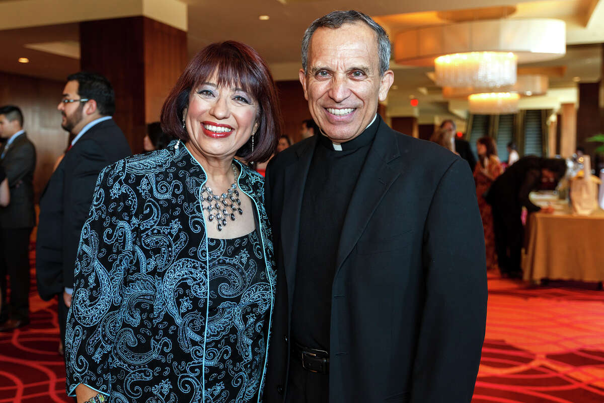 KSAT's Jessie Degollado ( left) and Father David Garcia pose for a photo during the San Antonio Associationn of Hispanic Journalists' 25th anniversary celebration at the Grand Hyatt on July 20, 2012. The event was SAAHJ's 14th annual scholarship gala. This year, in honor of its silver anniversary, it awarded $25,000 to 13 San Antonio college students pursuing careers in print and brodcast journalism as well as public relations and marketing. Degollado was honored with SAAHJ's Henry Guerra Lifetime Achievement Award for Excellence in Journalism and Father Garcia received its 2012 Community Service Award for his work in restoring San Fernando Cathedral, as its one-time rector, and for his ongoing work to renovate San Antonio's historic Spanish Colonial missions. MARVIN PFEIFFER/ mpfeiffer@express-news.net
