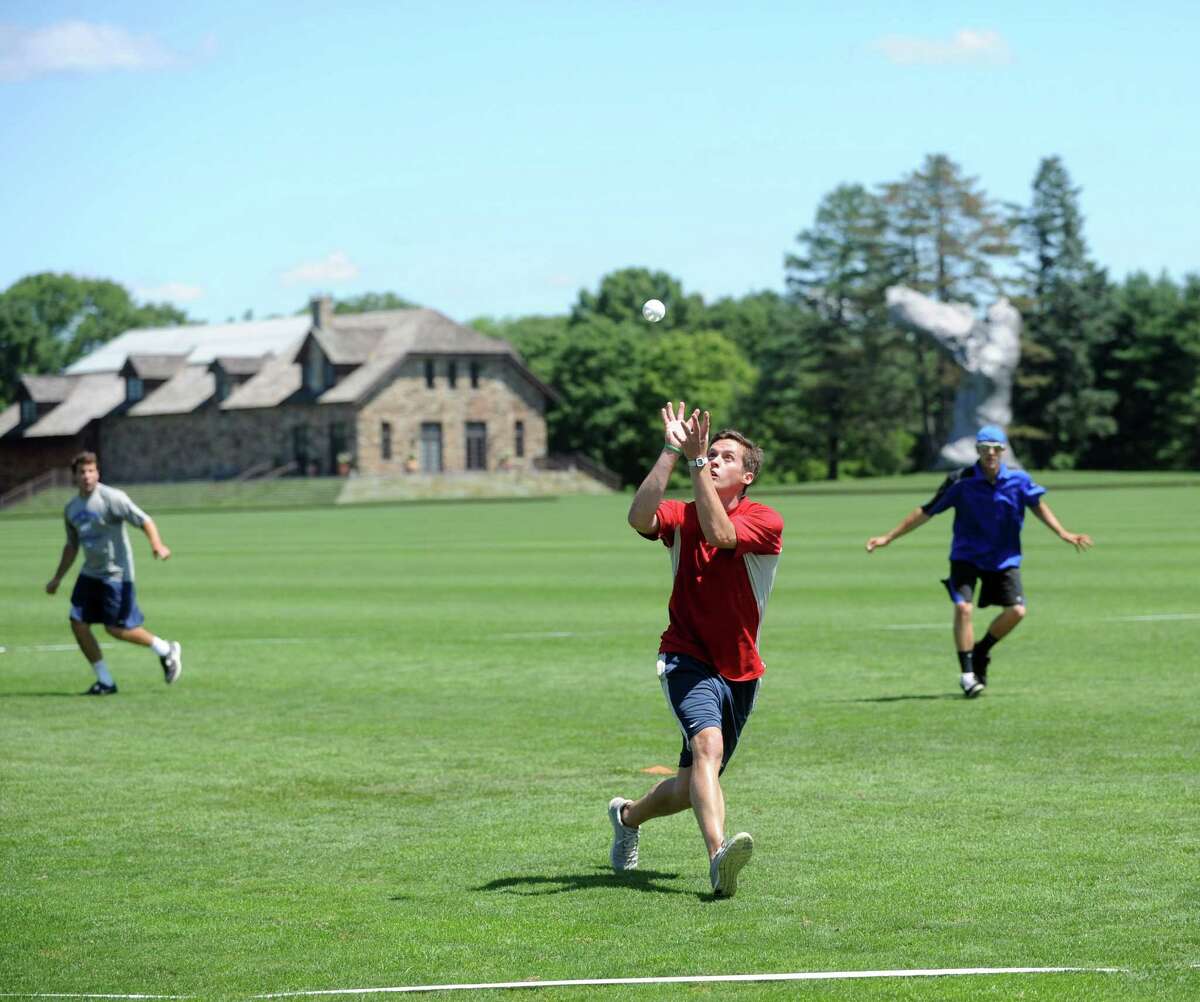 Tim Ferrone of team All American Wood makes a catch during Saturday's town-wide Greenwich Wiffle Ball Tournament at the Greenwich Polo Club on July 21, 2012.