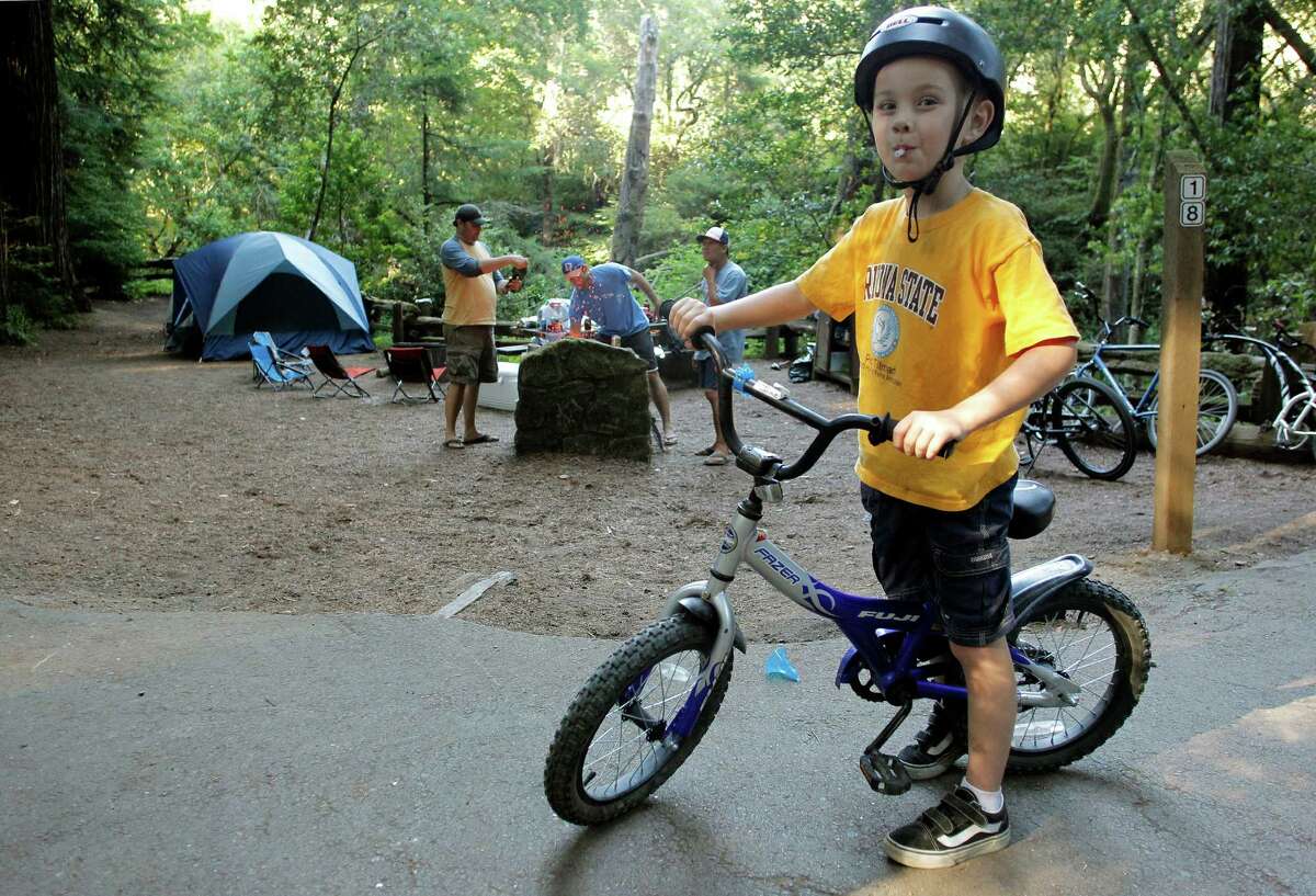 Jake Ryan, 6 enjoys riding his bike around the Samuel P. Taylor State Park campgroundsns that the $22 million deficit they said was the reason why they had to close parks was completely false.