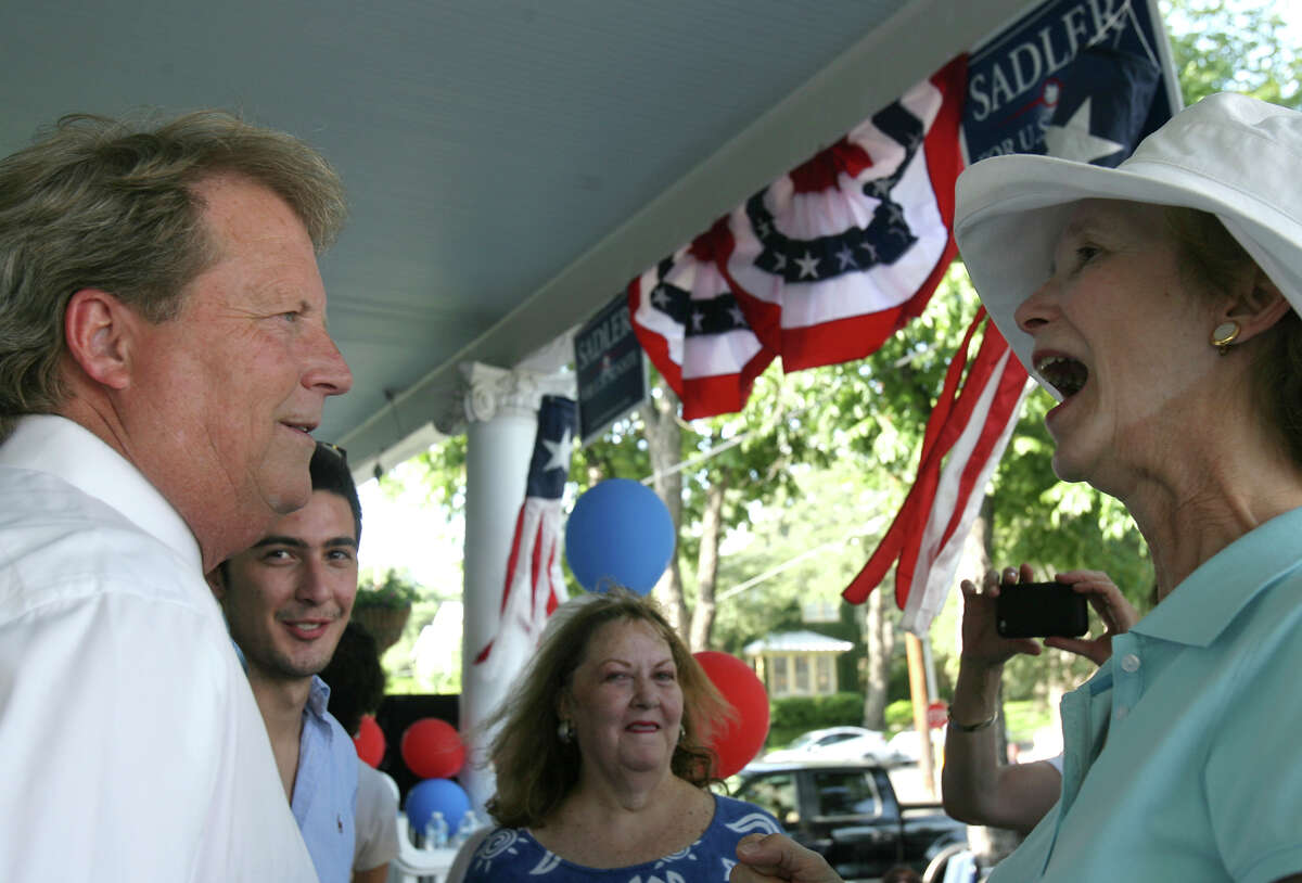 Paul Sadler talks to supporter Cynthia Butler Sunday July 22, 2012 at a democratic activist "get out the early vote" rally at the home of Bob and Jo Anne Comeaux. Sadler faces San Antonio retiree Grady Yarbrough in the race for the Democratic nomination for U.S. Senate.