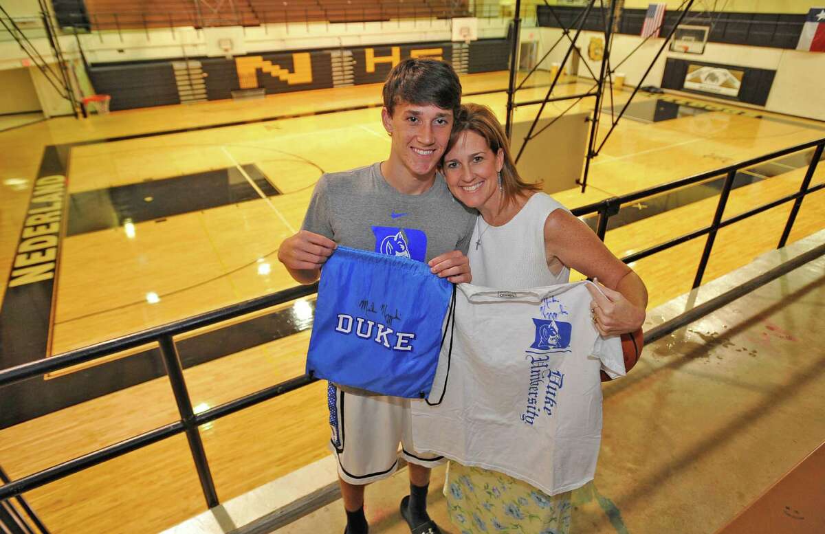 Nederland basketball player Kirby Hanley, left, and his mother, Shawn, will be guests of Duke basketball coach Mike Krzyzewski at a game this upcoming season. Hanley was attending the Duke basketball camp in late June when he and his mother had to leave early because his father was ill from cancer. Hanley's father died a few days later. Krzyzewski reached out to the family through email. Dave Ryan/The Enterprise