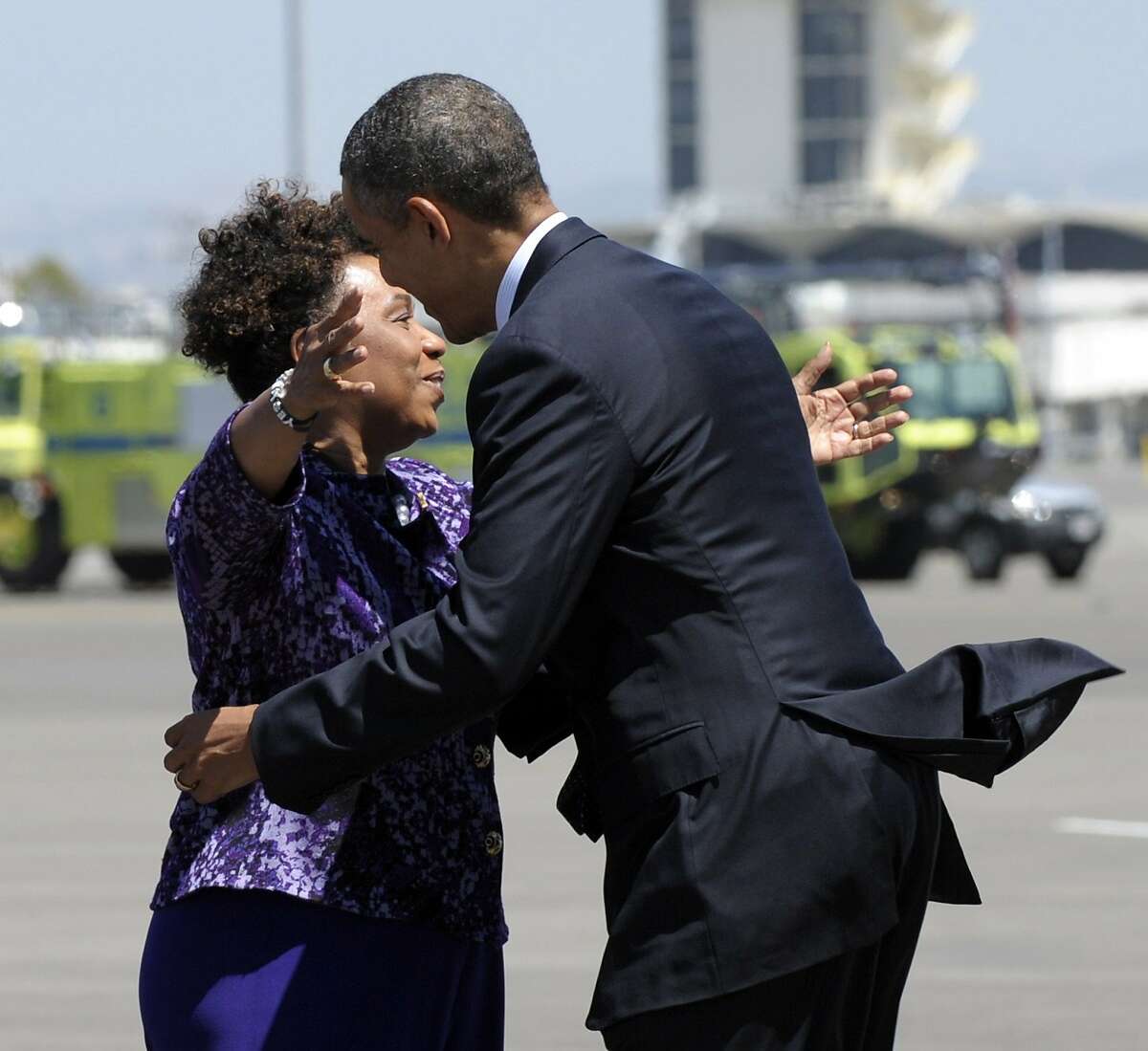 President Barack Obama gets a hug from Rep. Barbara Lee, D-Calif., after arriving at Oakland International Airport in Oakland, Calif., Monday, July 23, 2012. (AP Photo/Susan Walsh)
