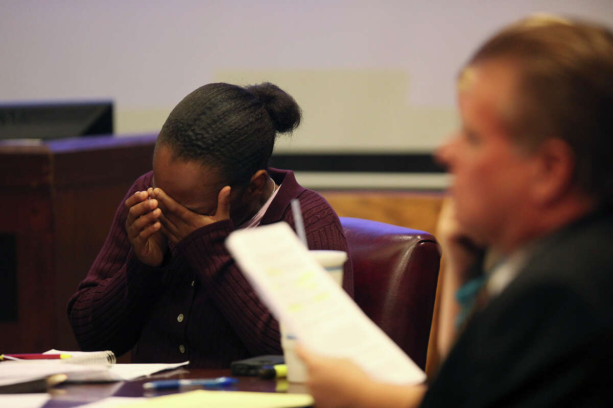 Tiffany James, 20, cries as the 911 tapes are played during her murder trial in the Bexar County 399th District Court, Monday, July 23, 2012. James is accused of murdering her boyfriend, Antwan Wolford during a domestic disturbance in November 2009.