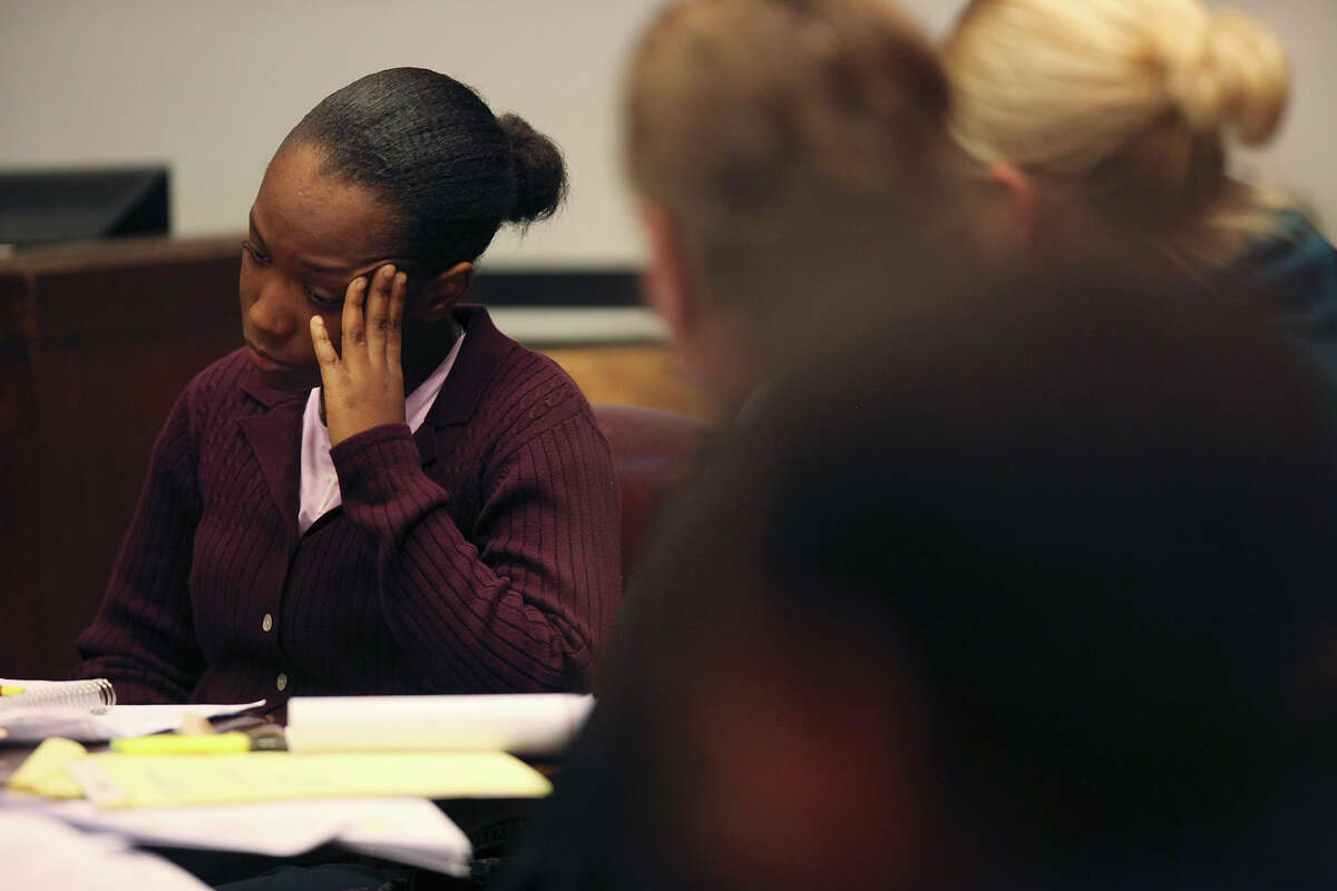 Tiffany James, 20, reacts as the prosecution introduces forensic evidence during her murder trial in the Bexar County 399th District Court, Monday, July 23, 2012. James is accused of murdering her boyfriend, Antwan Wolford in November 2009. Prosecutors rest their case late Monday.