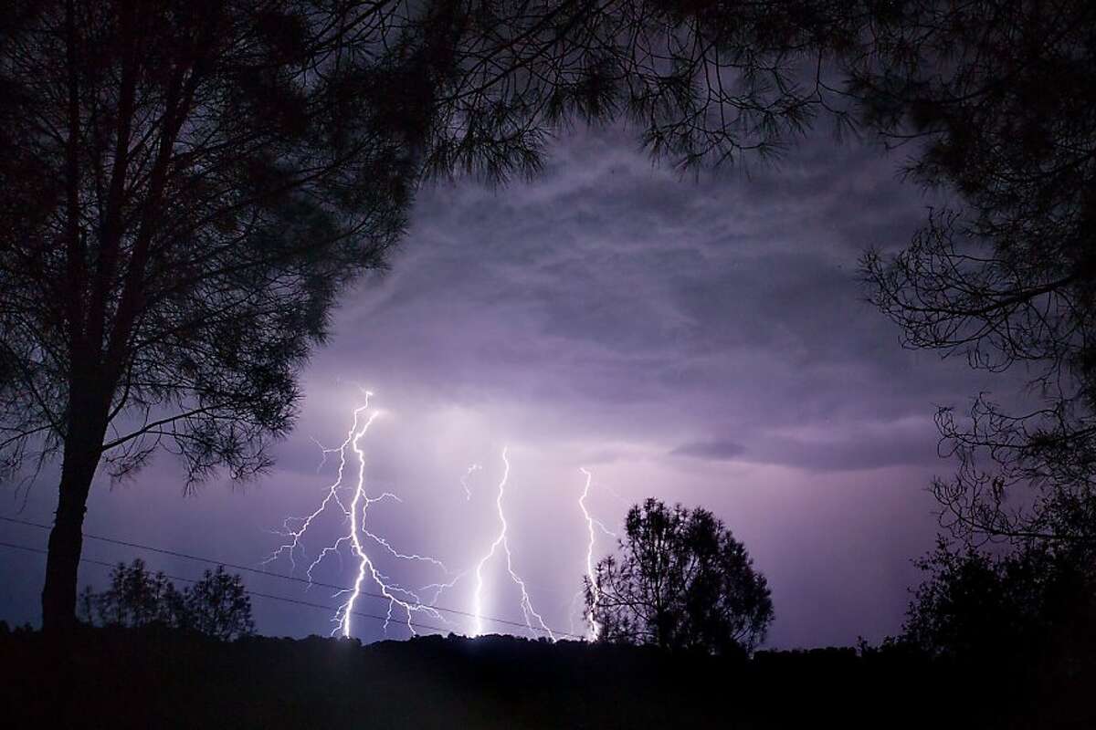 Lightning cracks through the sky over El Dorado and Amador county near Sacramento, Calif., in the early morning Monday, July 23, 2012. (AP Photo/The Sacramento Bee, Randall Benton) MAGS OUT; TV OUT; MANDATORY CREDIT