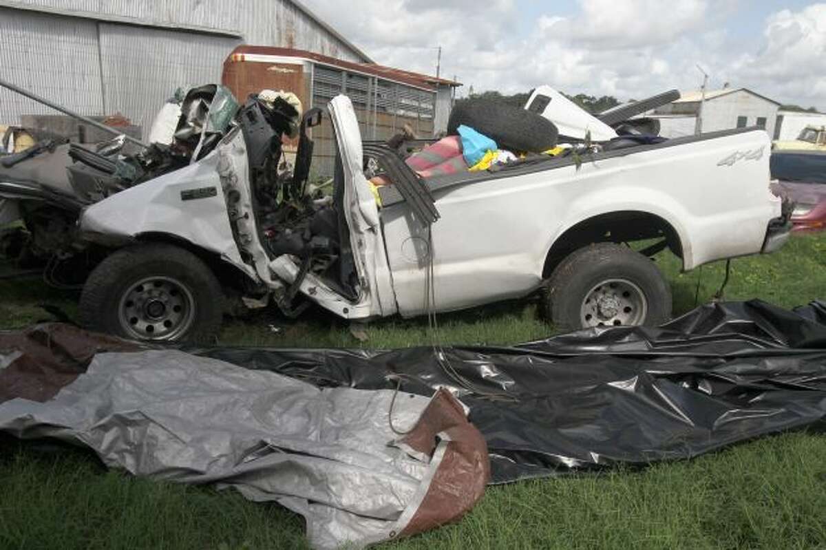 This is what's left of a 2000 Ford F-250 pickup truck after it crashed into a tree on the side of U.S. Highway 59 between Goliad and Beeville, Texas before 7:00 p.m. Sunday July 22, 2012. Thirteen people died in the accident and the truck was carrying more than 20 people when the accident took place. The truck is currentlly at the Goliad Sheriff's Office in Goliad, Texas. John Davenport/ San Antonio Express-News Photo: San Antonio Express-News / SA