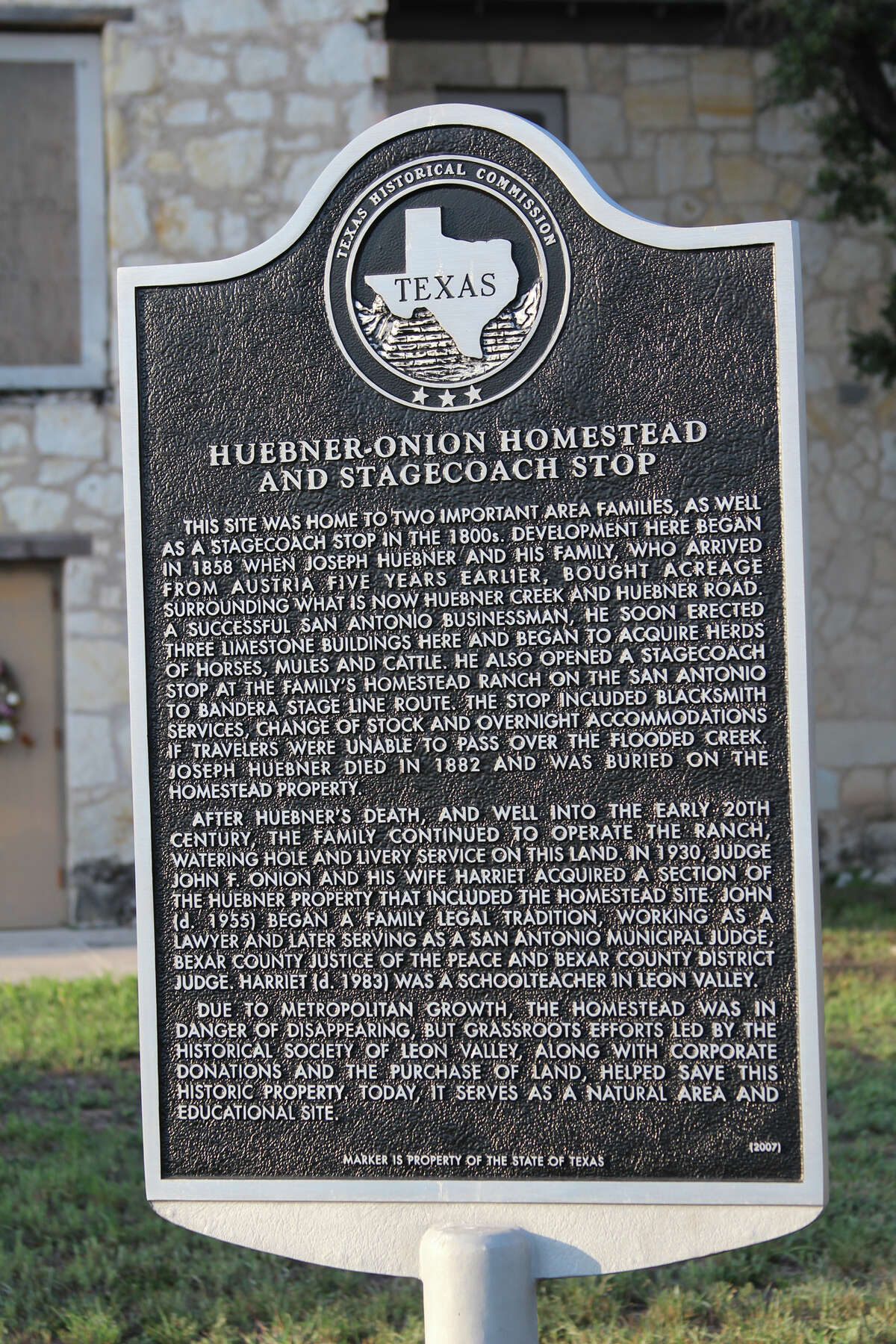 A Texas Historical Commission sign spells out the significance of the Huebner-Onion Homestead and Stagecoach Stop, a site 10,000 or more motorists pass by every day on Bandera Road in Leon Valley.