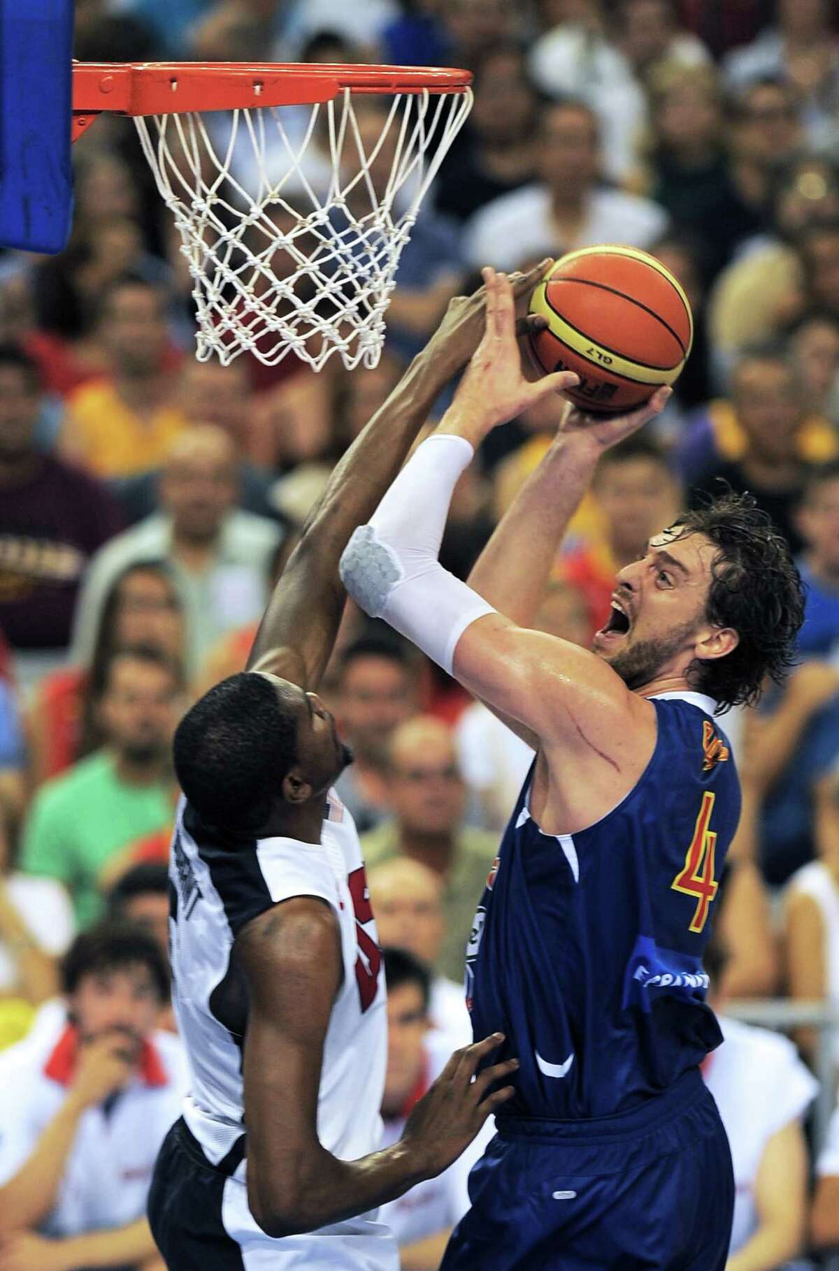 Spain's Pau Gasol (R) vies with Kevin Durant (L) during the Pre-Olympic friendly basketball match between Spain and USA at Palau Sant Jordi in Barcelona on July 24, 2012. AFP PHOTO / LLUIS GENELLUIS GENE/AFP/GettyImages