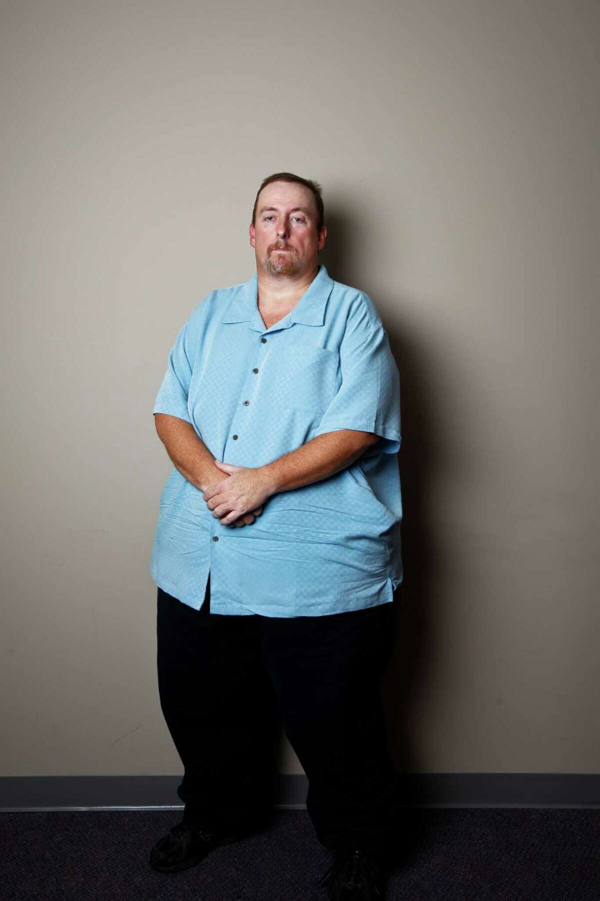 Ronald Kratz II was fired from his job because his employees said he was morbidly obese with a weight of 600 pounds. The EEOC has sued BAE Systems on his behalf under the Americans with Disabilities Act. Wednesday, Sept. 28, 2011, in Houston. ( Michael Paulsen / Houston Chronicle )