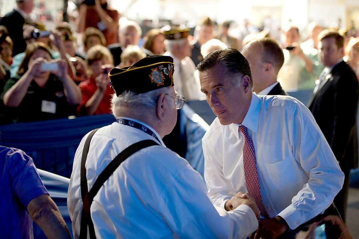 Jim Thone of Bakersfield, California, meets Republican presidential candidate Mitt Romney during the VFW convention at the Reno-Sparks Convention Center in Reno, Nevada, Tuesday, July 24, 2012. (Jose Luis Villegas/Sacramento Bee/MCT)