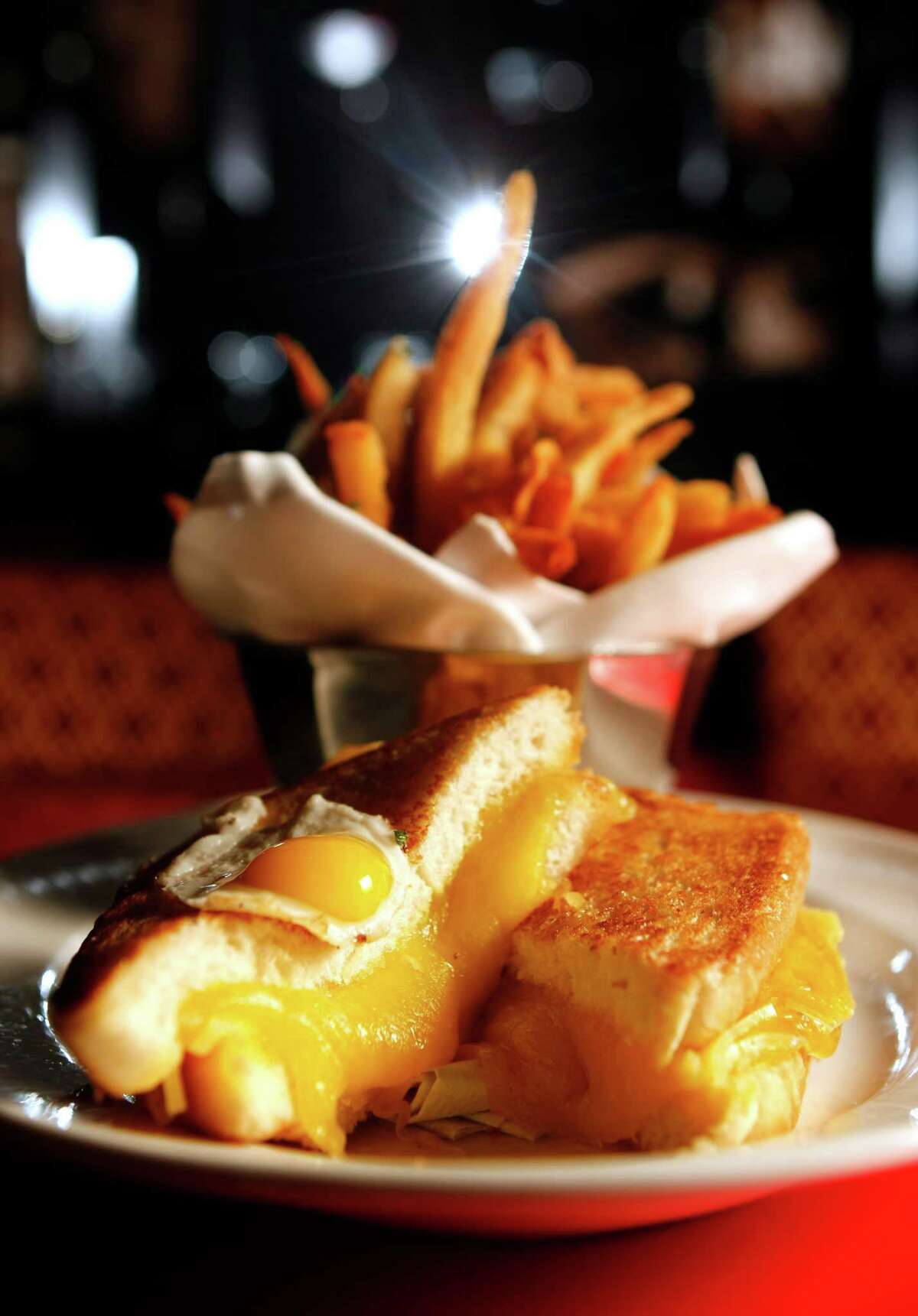 Texas Toast grilled cheese and French fries at Strip House downtown Tuesday, June 12, 2012, in Houston. ( Johnny Hanson / Houston Chronicle )