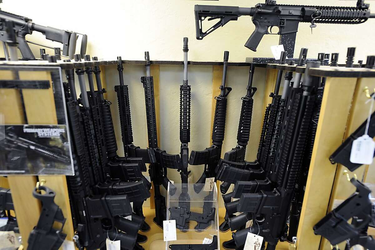 An assortment of semi-automatic rifles are seen in a display at Gary Kolander's shop Gun Vault in Mountain View, CA Wednesday July 25th, 2012.