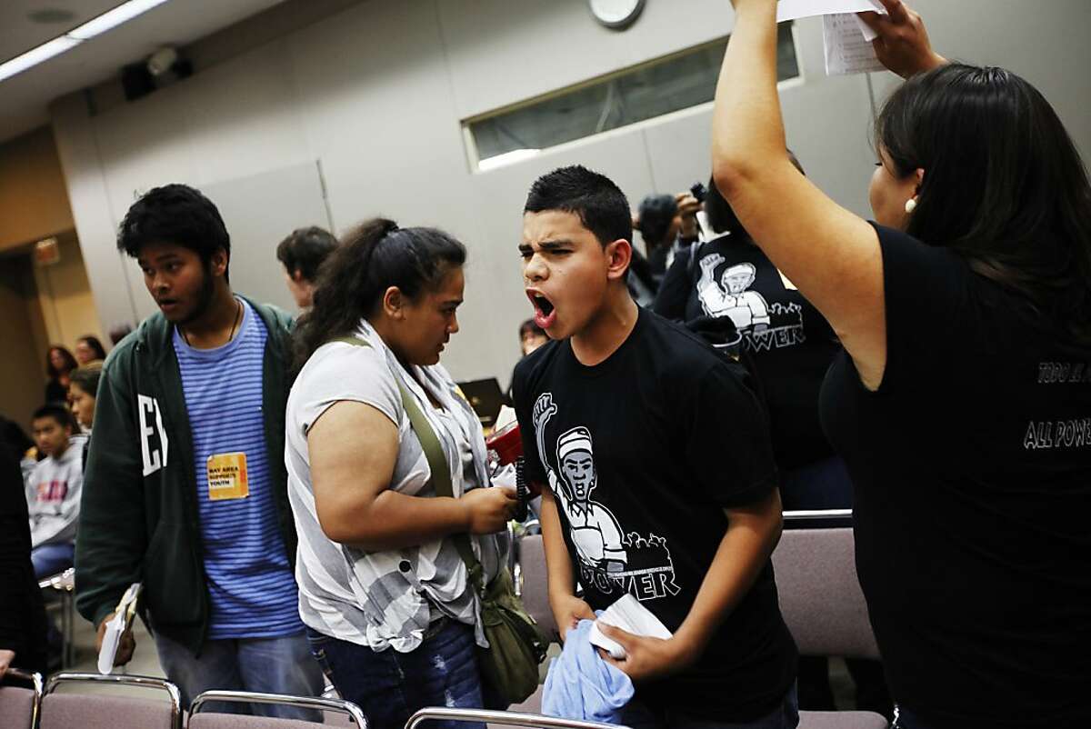 Sammy Tijerino shouts against the Metropolitan Transportation Commission which voted 8:7 against free fares for low-income youth on Muni during their meeting in Oakland on Wednesday.