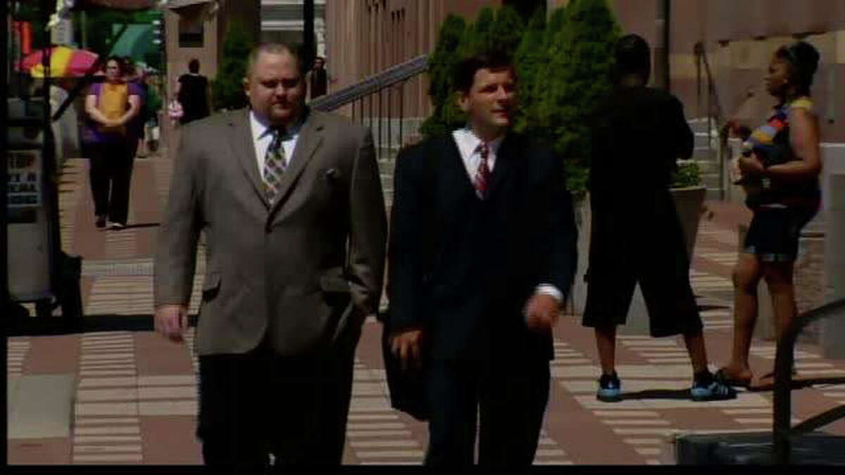 Former finance director for Christopher Donovan's Congressional campaign, Robert Braddock Jr., left and his attorney, Frank J. Riccio II, walk into federal court in New Haven, Conn. on Thursday, July 12, 2012. Braddock was indicted by a federal grand jury on July 11 for his alleged role in a conspiracy to conceal the identities of campaign donors. Braddock entered a not guilty plea during his July 12 court appearence.