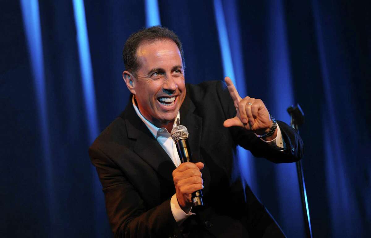 FILE - This June 30, 2012 file photo released by the David Lynch Foundation shows comedian Jerry Seinfeld performing onstage at the David Lynch Foundation: A Night of Comedy honoring George Shapiro in Beverly Hills, Calif. Seinfeld will perform in each of the five boroughs of New York on Thursday nights in October and November. The first performance is at Manhattan's Beacon Theater on Oct. 4. (Photo by John Shearer/Invision for David Lynch Foundation, file)