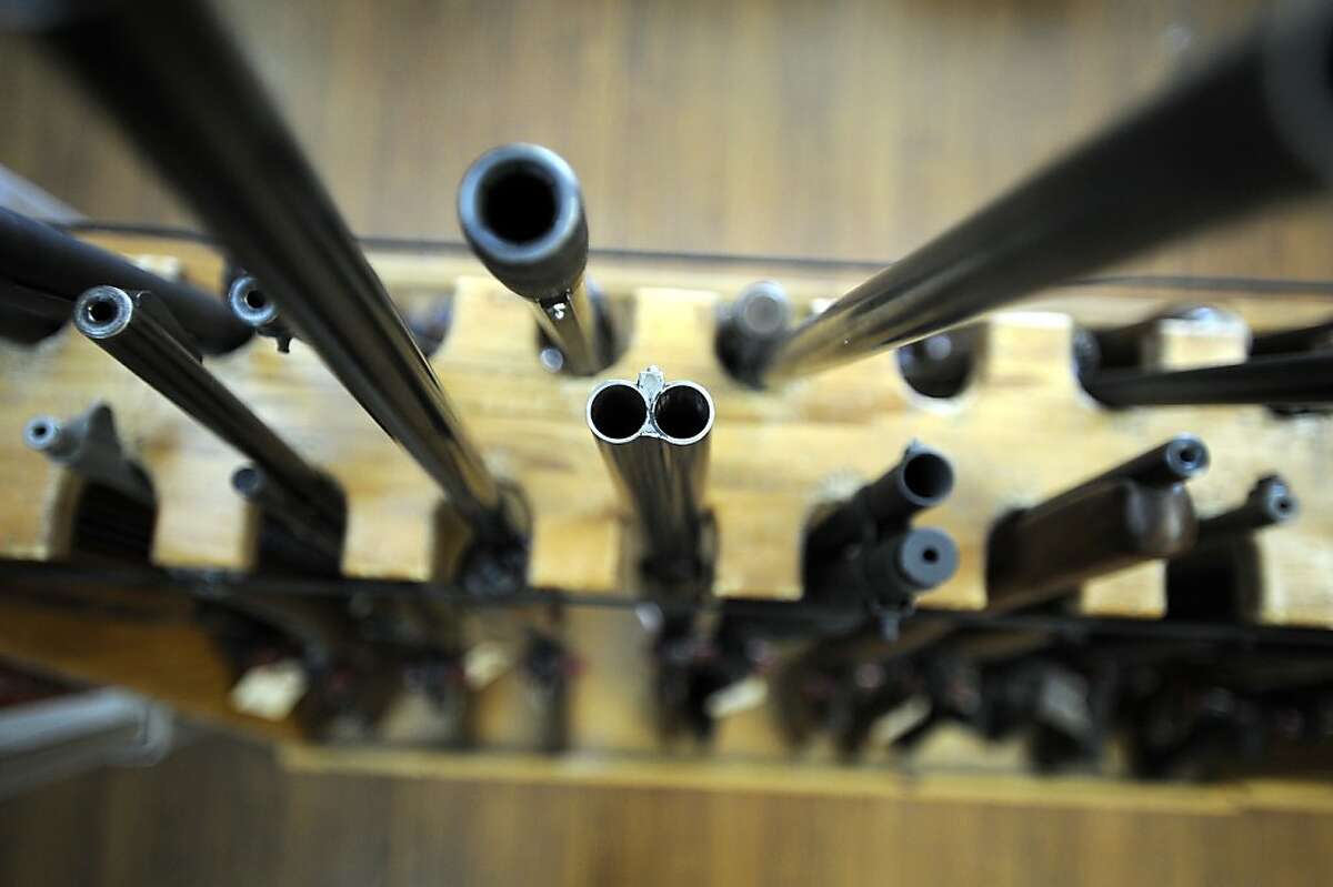 Various used guns are seen in a display at Gary Kolander's shop Gun Vault in Mountain View, CA Wednesday July 25th, 2012.
