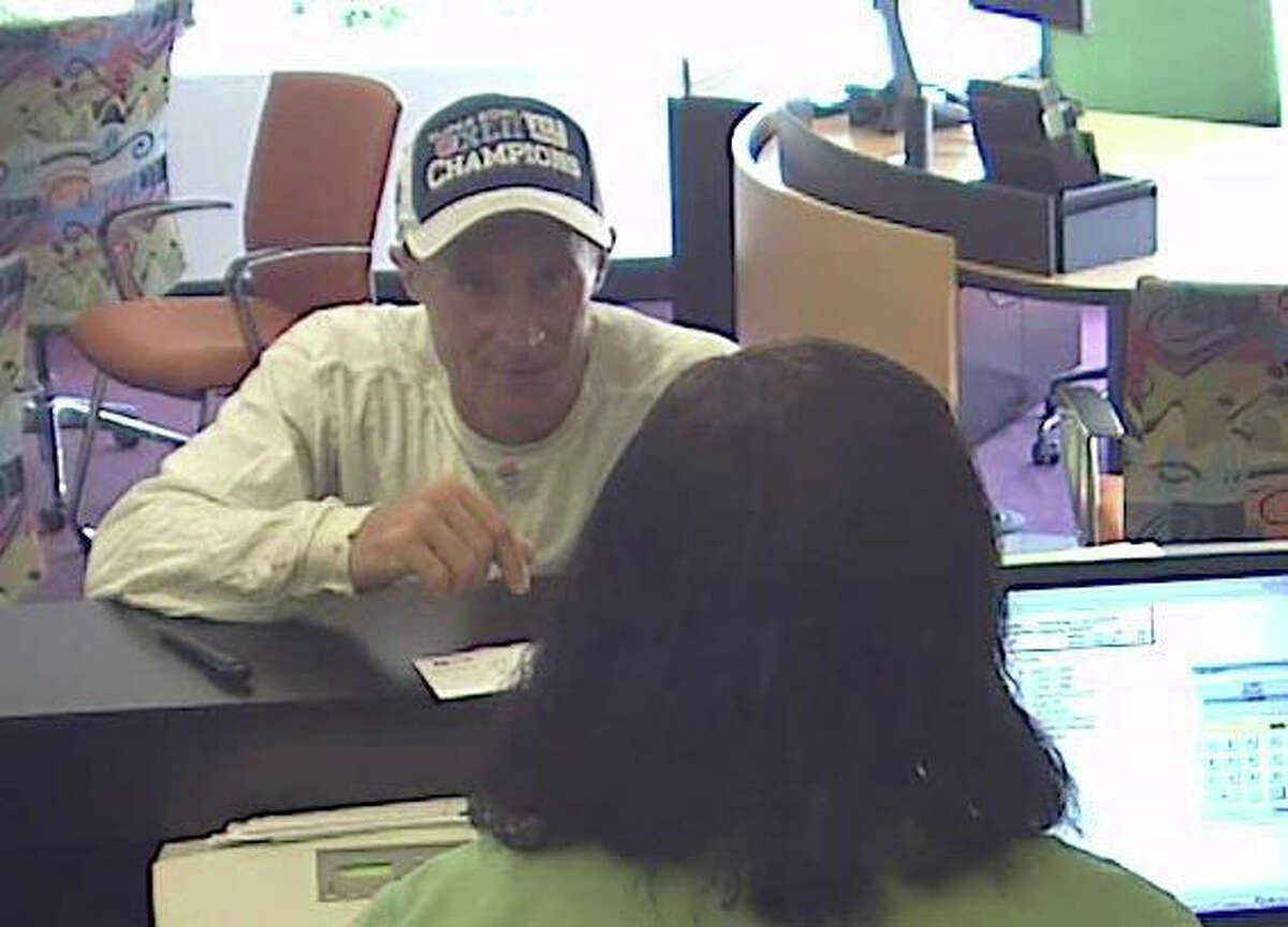 Police are searching for this man, who they say robbed the TD Bank, 975 Madison Ave., Bridgeport, Conn., on Friday, July 27, 2012 and then fled on foot toward Garfield Avenue with an unknown amount of money. Anyone with information can contact detectives at 203-581-5250 or 203-581-5242.