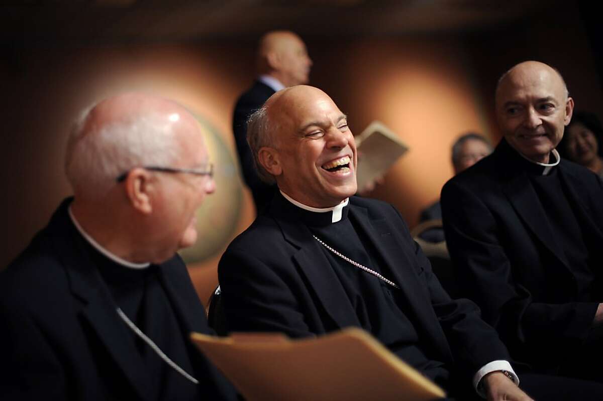 Archbishop Cordileone(center) and outgoing Archbishop Niederauer share a laugh before the start of the press conference at St. Mary's Cathedral in San Francisco Friday July 27th, 2012. Archbishop-elect Salvatore J. Cordileone, 56, was named the Metropolitan Archbishop of San Francisco by Pope Benedict XVI, the Vatican announced early Friday.
