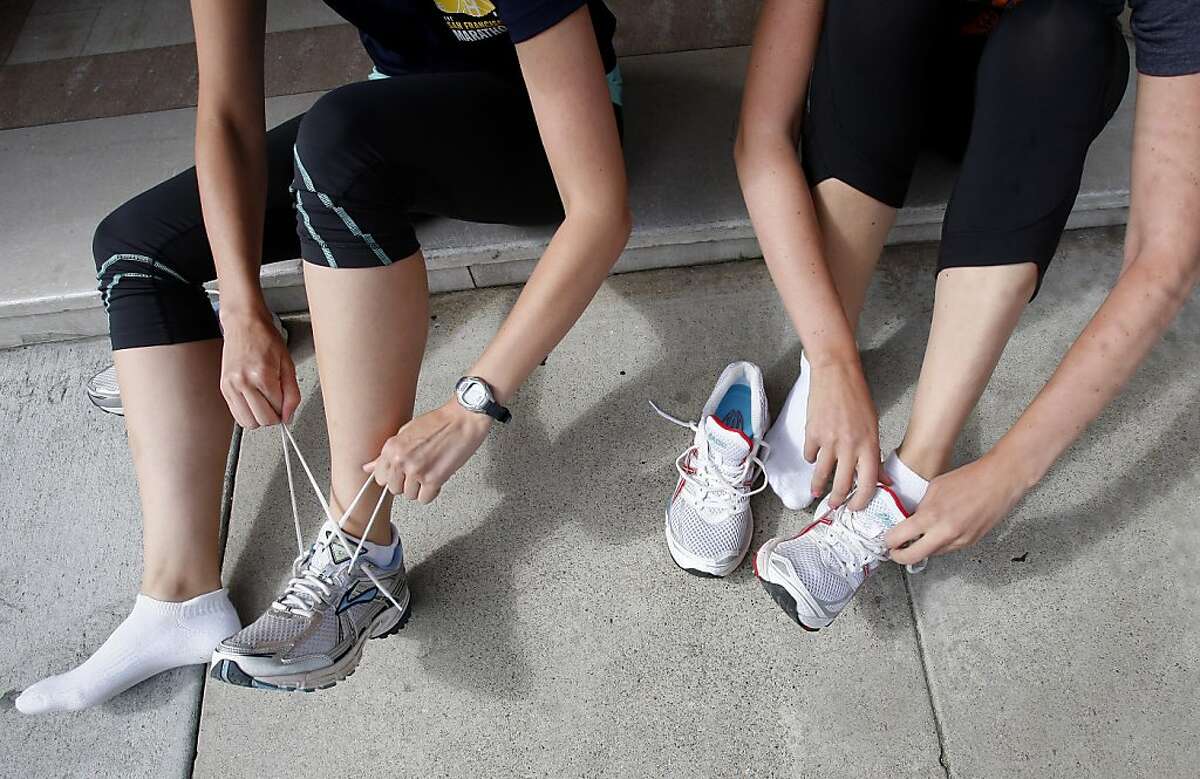 The Welch sisters prepare for a workout in front of their apartment building. Jackie and Becky Welch, sisters who live in San Francisco, Calif., will be running their first half marathon, a popular run distance, during this years San Francisco Marathon.