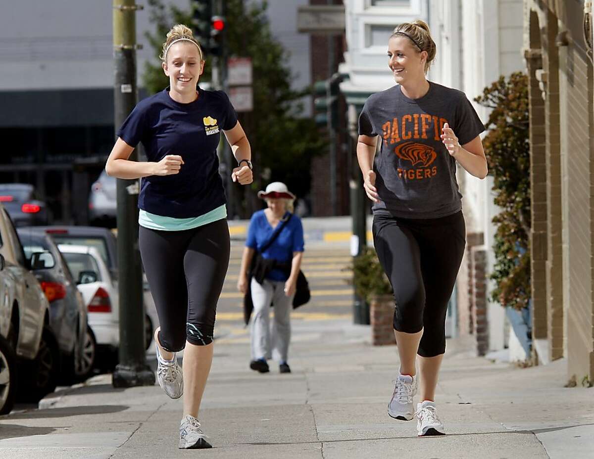 Becky Welch (left) and her sister Jackie Welch (right) head up Polk Street, working out for the upcoming marathon. Jackie and Becky Welch, sisters who live in San Francisco, Calif., will be running their first half marathon, a popular run distance, during this years San Francisco Marathon.