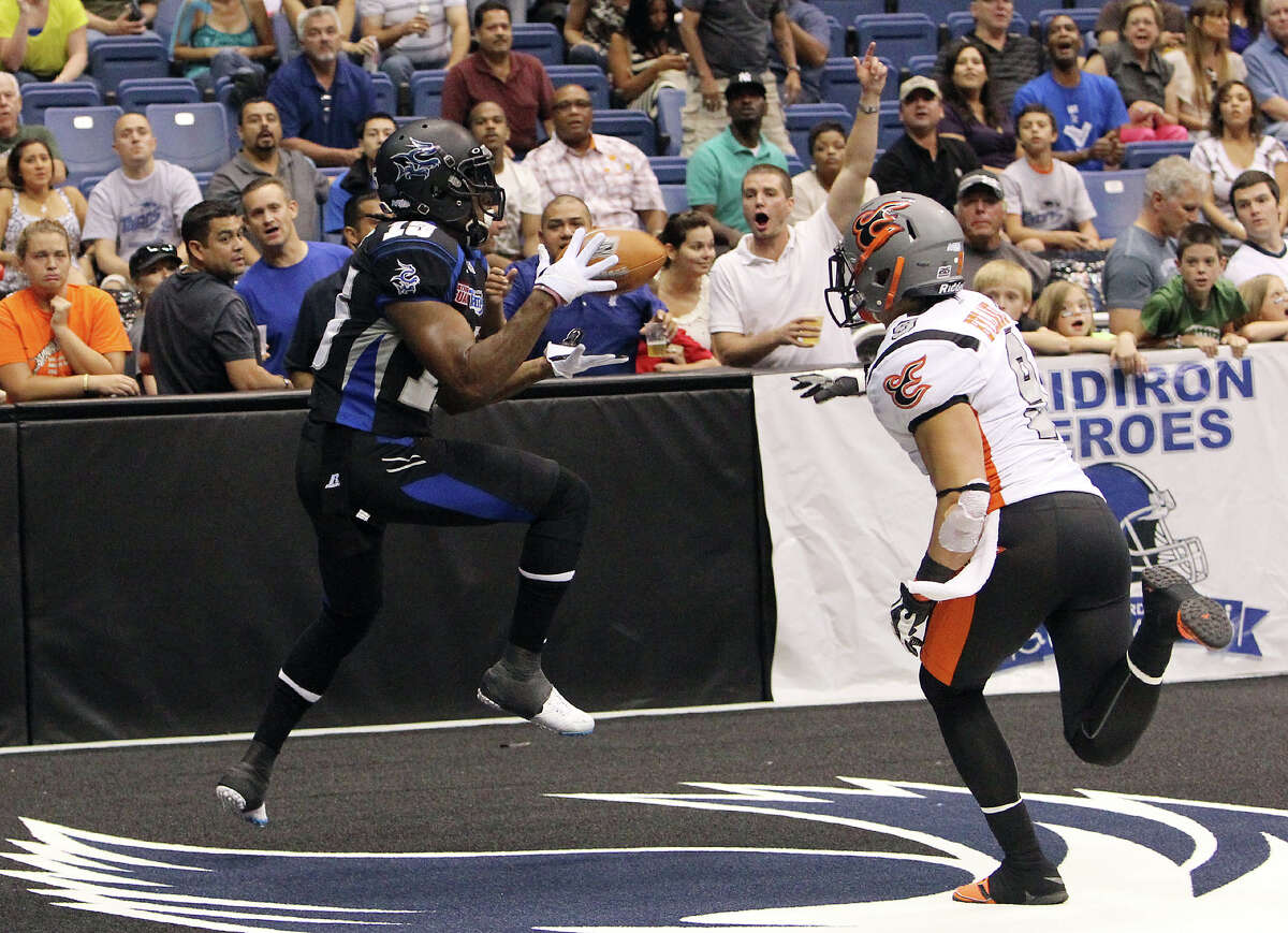 San Antonio Talons' Jomo Wilson (15) reels in a catch for a touchdown against Utah Blaze's David Hyland (09) in the first half of their quarterfinal AFL National Conference playoff game at the Alamodome on Friday, July 27, 2012.