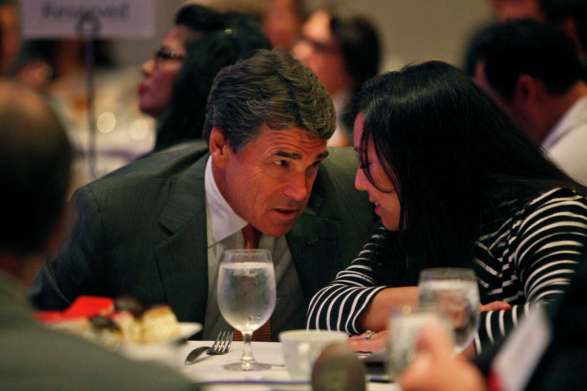 Governor Rick Perry talks with Jennifer Korn, Executive Director of the Hispanic Leadership Network, before speaking at the Hispanic Leadership Network's Small Business Invitational at the Marriott Rivercenter Hotel in San Antonio on Saturday, July 28, 2012.
