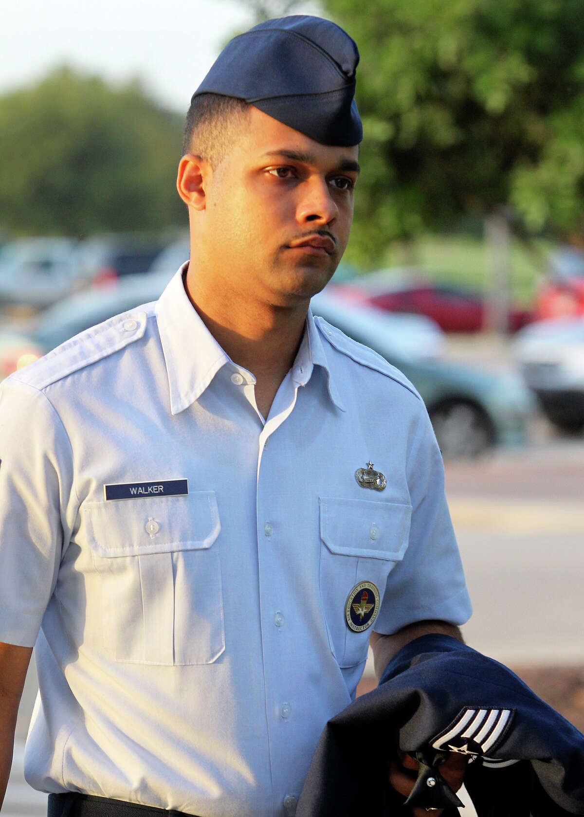 Air Force Sgt. Luis Walker enters the 37th Training Wing Headquarters for sentencing on July 21, 2012.