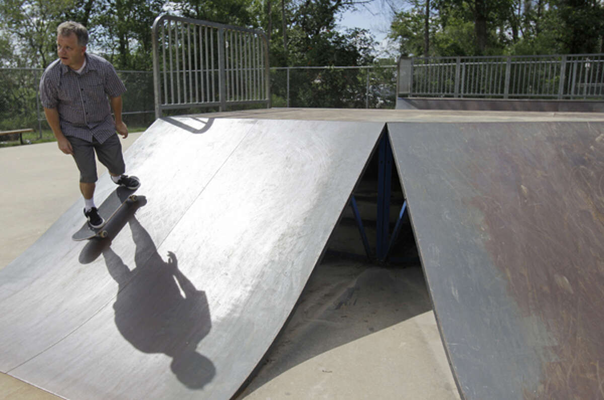 Steve Peltier skates at the skate park in Collins Park, 6727 Cypresswood Drive, Thursday, July 19, 2012, in Spring.