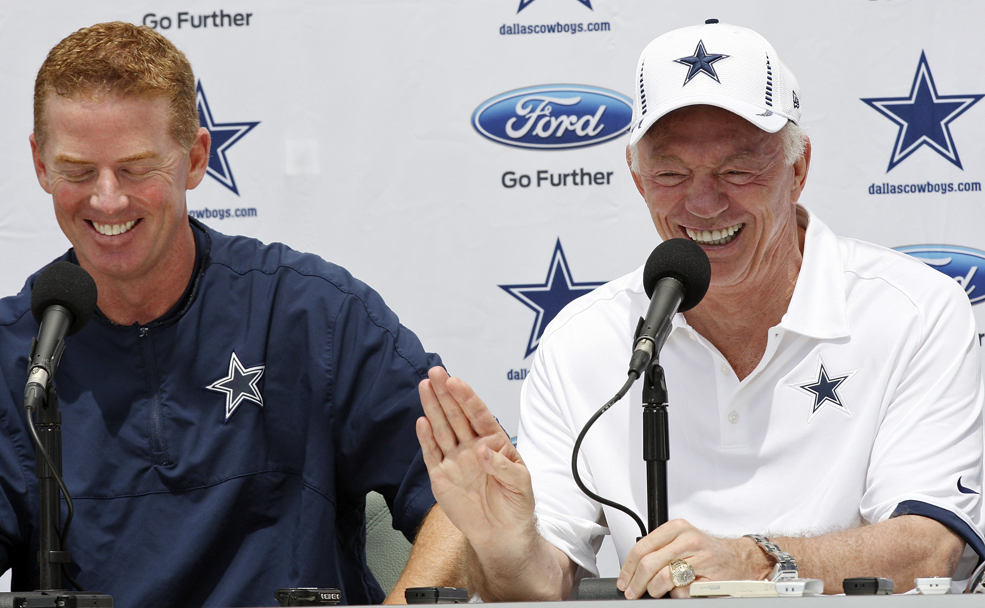 Dallas Cowboys Executive Vice President Jerry Jones Jr., left, and Chief  Operating Officer Stephen Jones, right, on the field before the start of an  NFL football game against the Washington Redskins, Sunday