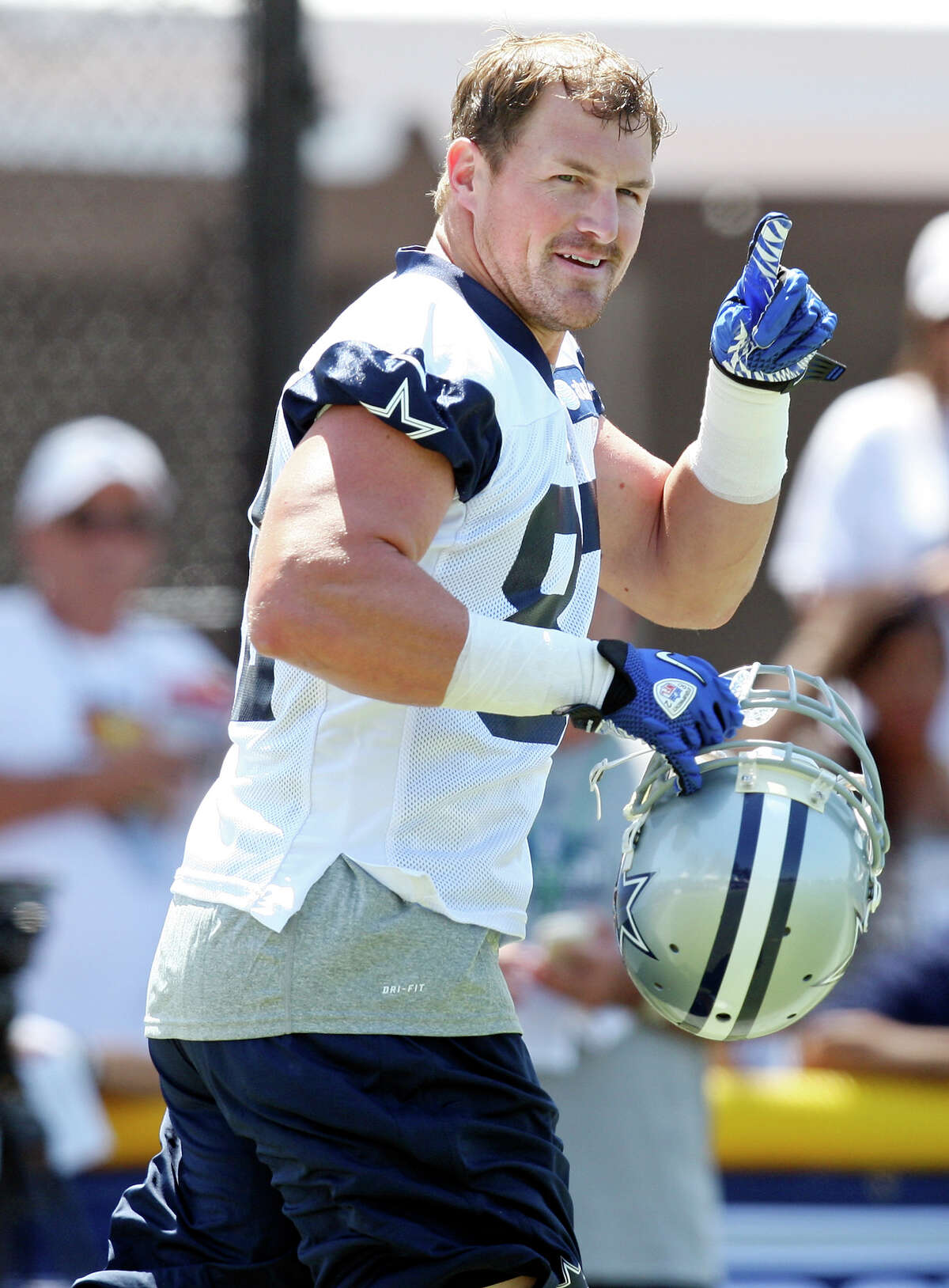Dallas Cowboys tight end Jason Witten points at fans during the first day of their 2012 training camp held Monday July 30, 2012 in Oxnard, CA.