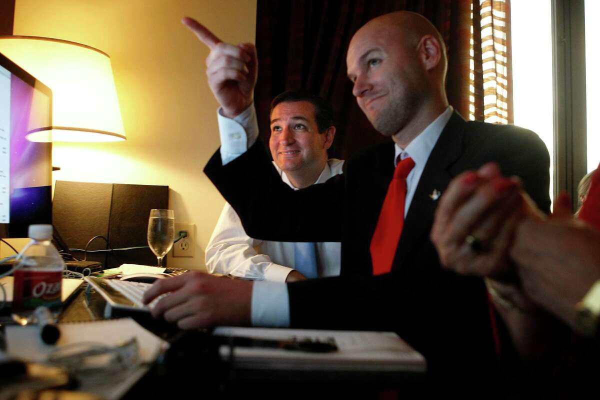 U.S. Senator candidate Ted Cruz, left, and his general consultant Jason Johnson look at early returns in his war room at the JW Marriott in the Galleria during his runoff election against rival Republican Lt. Gov. David Dewhurst for the U.S. Senate seat vacated by Kay Bailey Hutchison Tuesday, July 31, 2012, in Houston.
