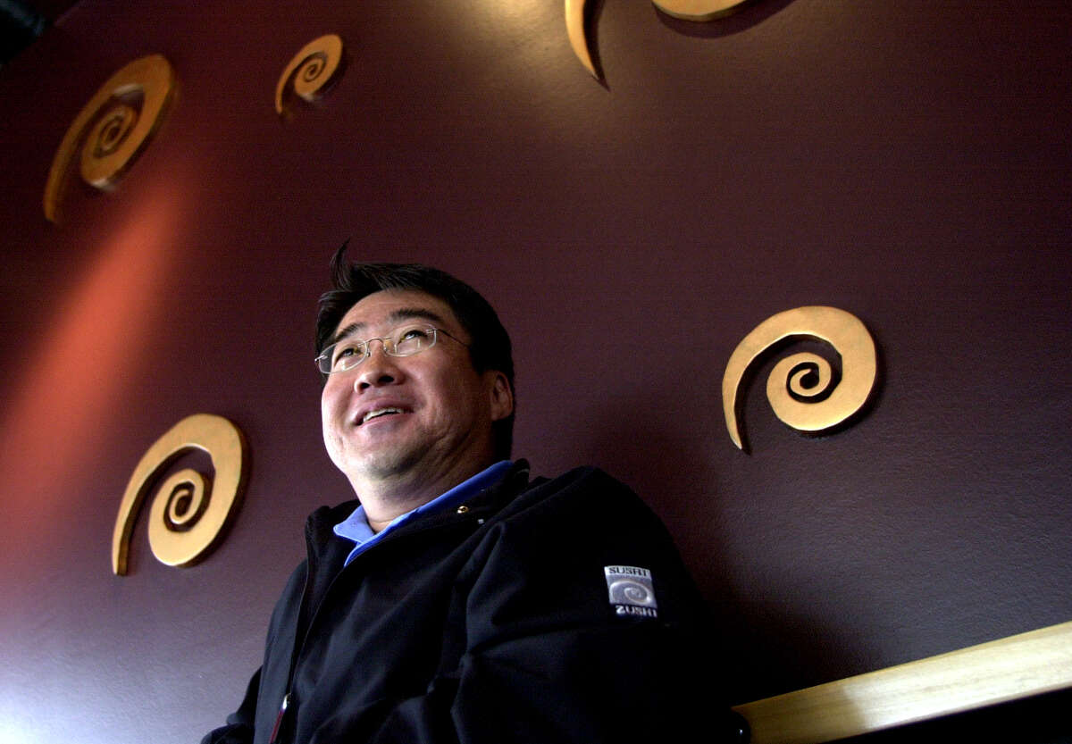 Al Tomita, president of Sushi Zushi, Inc., stands in his newest Sushi Zushi restaurant on 1604 at Stone Oak Parkway on Friday, April 16, 2004.