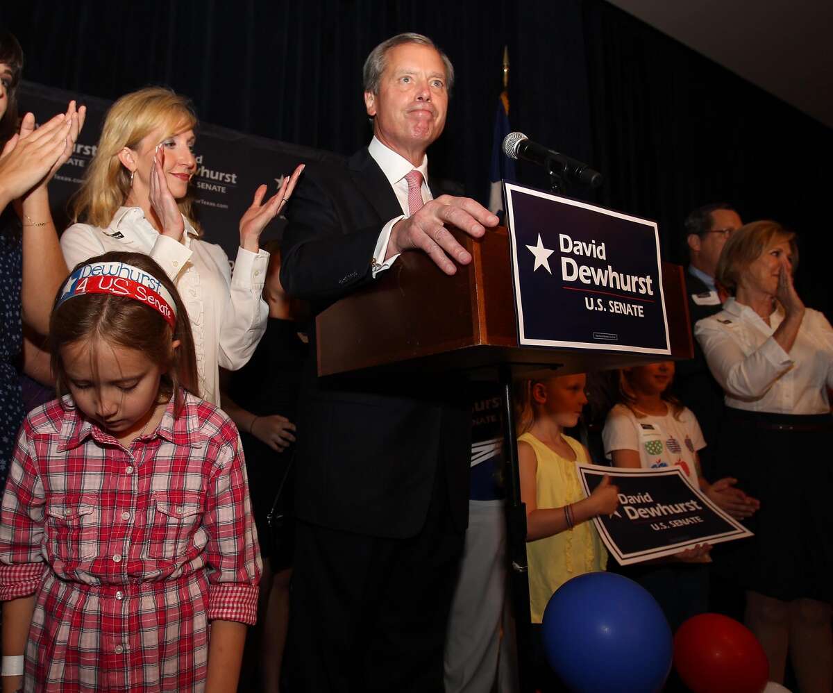 David Dewhurst gives his concession speech with his wife, Tricia, and his daughter Carolyn, 8, at his side at the Houston Omni.