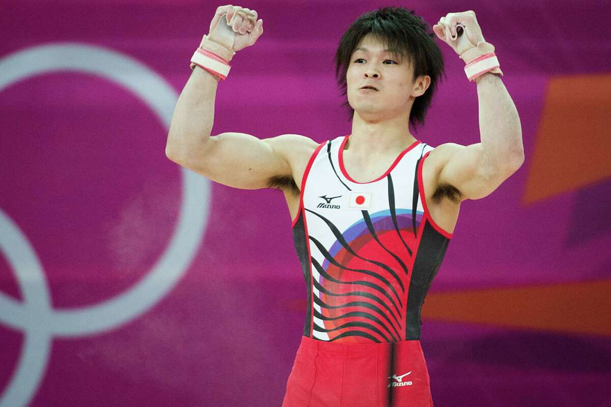 Kohei Uchimura of Japan reacts after performing on the horizontal bar during the men's gymnastics team final at the 2012 London Olympics on Monday, July 30, 2012. The USA finished in 5th place. ( Smiley N. Pool / Houston Chronicle )